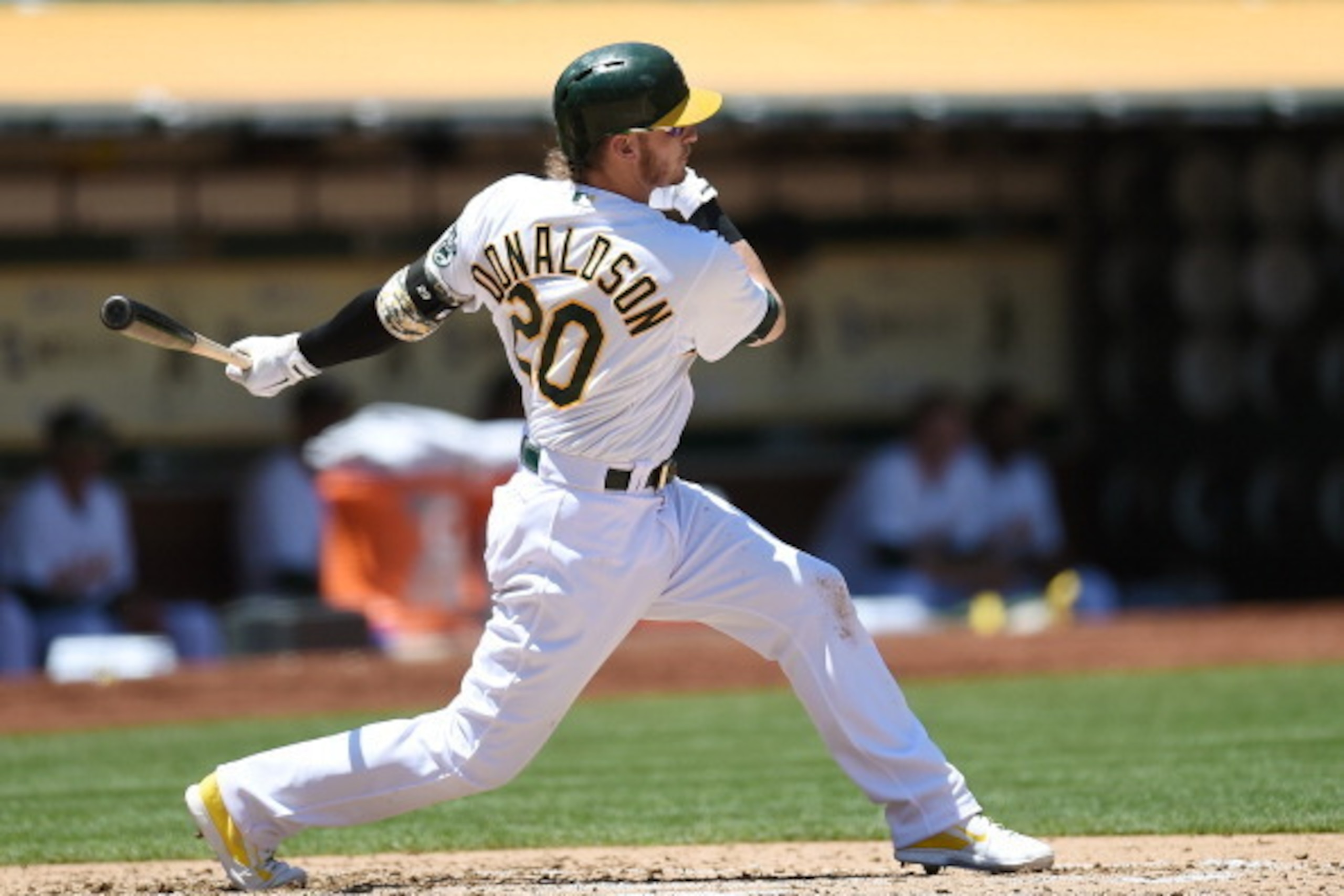 OAKLAND, CA - JUNE 01:  Josh Donaldson #20 of the Oakland Athletics hits a two-run single scoring Eric Sogard #28 and Coco Crisp #4 in the bottom of the third inning against the Los Angeles Angels of Anaheim at O.co Coliseum on June 1, 2014 in Oakland, Ca