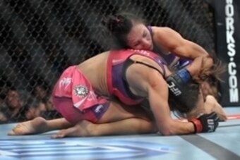 April 13, 2013; Las Vegas, NV, USA; Cat Zingano holds down Miesha Tate during the TUF 17 Finale at the Mandalay Bay Events Center. Mandatory Credit: Gary A. Vasquez-USA TODAY Sports