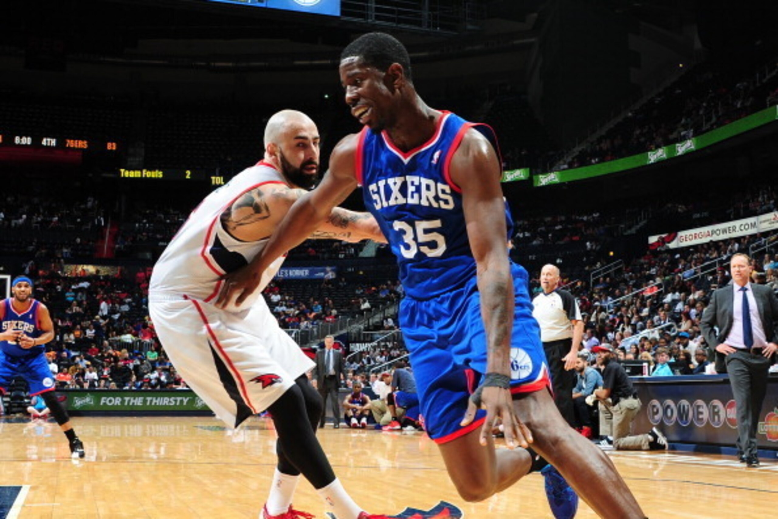 ATLANTA, GA - MARCH 31: Henry Sims #35 of the Philadelphia 76ers drives to the basket against the Atlanta Hawks on March 31, 2014 at Philips Arena in Atlanta, Georgia.  NOTE TO USER: User expressly acknowledges and agrees that, by downloading and/or using