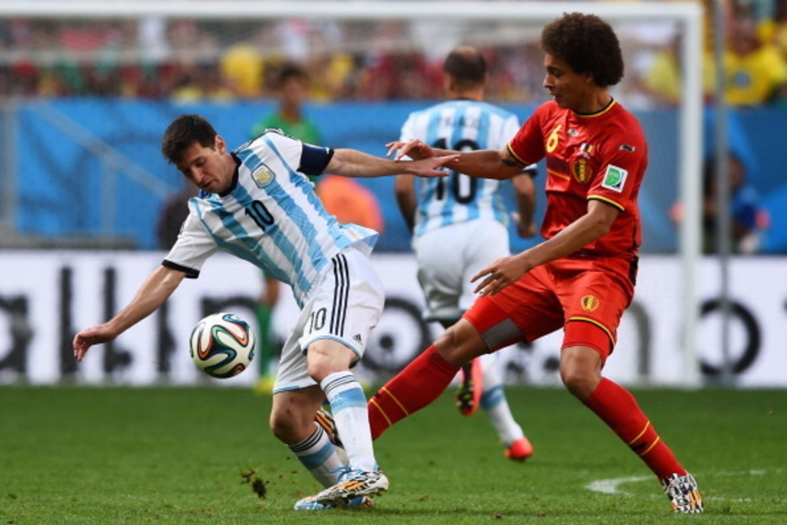 BRASILIA, DF - JULY 05: Lionel Messi of Argentina is challenged by Axel Witsel of Belgium during the 2014 FIFA World Cup Brazil Quarter Final match between Argentina and Belgium at Estadio Nacional on July 5, 2014 in Brasilia, Brazil.  (Photo by Matthias 
