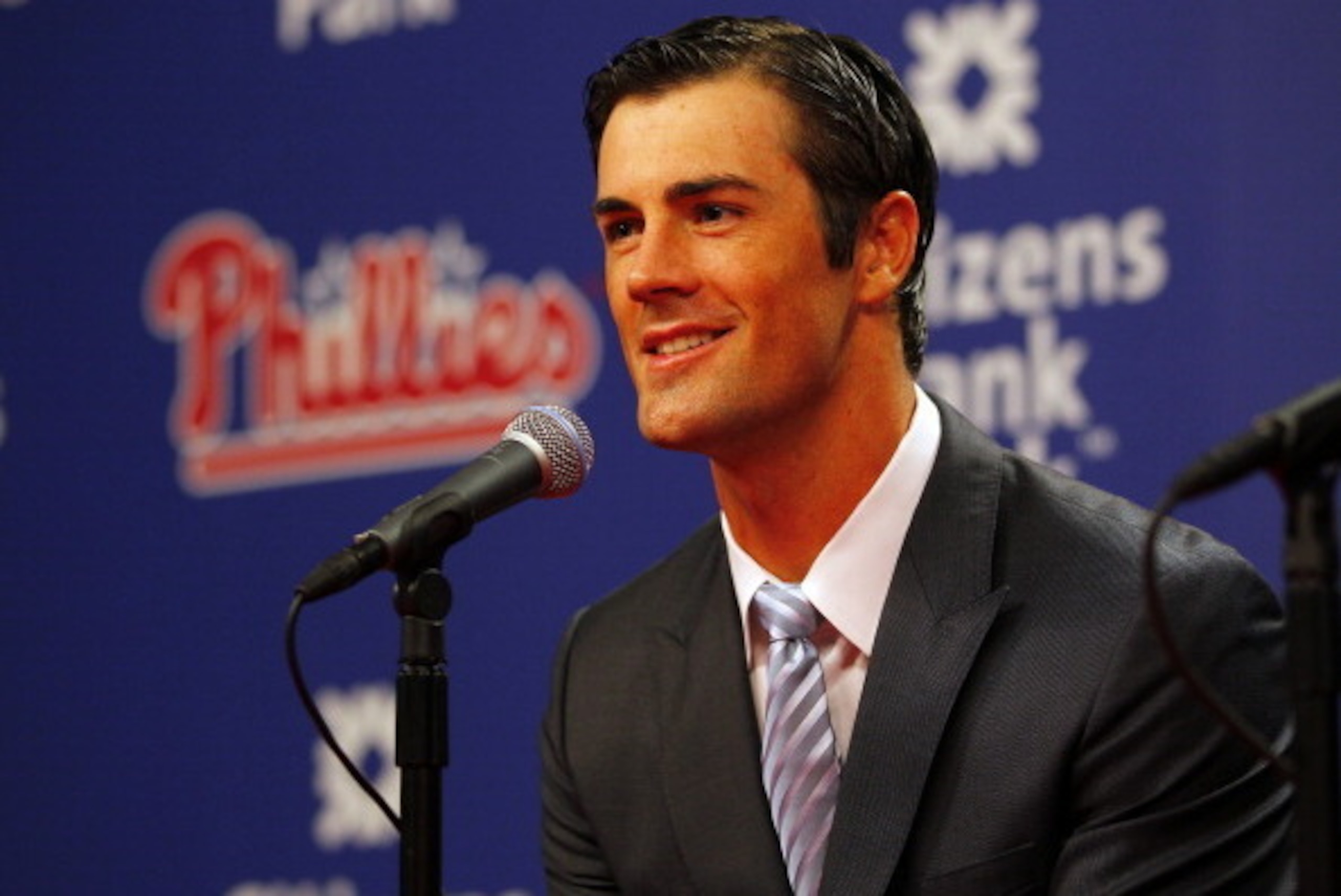 PHILADELPHIA, PA - JULY 25: Cole Hamels of the Philadelphia Phillies and team Senior Vice President and General Manager Ruben Amaro Jr. (not pictured) announce Hamels six-year, $144 million contract extension before the start of their MLB baseball game ag