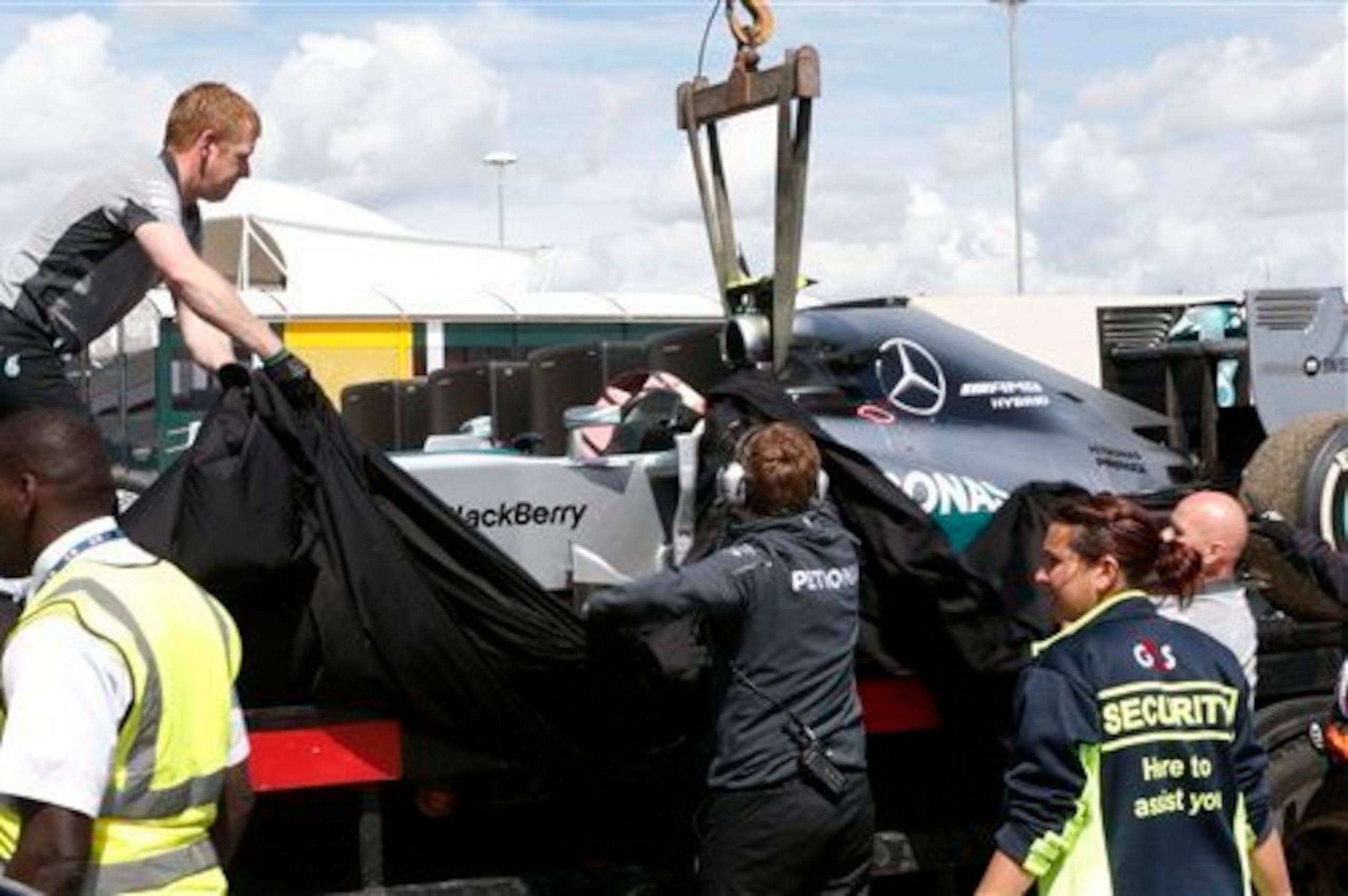 Rosberg's stricken Mercedes is returned to the pits. Rosberg's stricken Mercedes is returned to the pits.