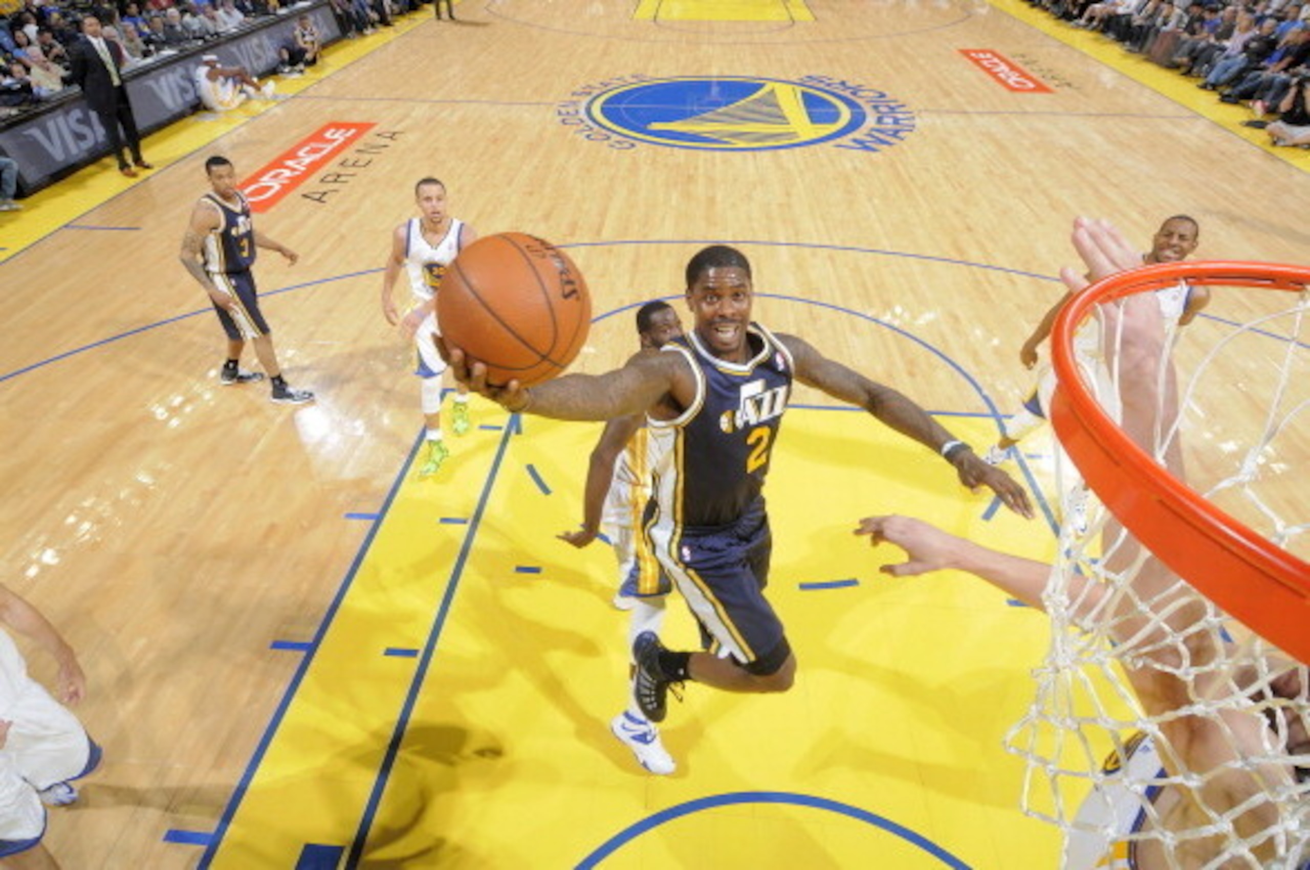 OAKLAND, CA - APRIL 6: Marvin Williams #2 of the Utah Jazz drives to the basket against the Golden State Warriors on April 6, 2014 at Oracle Arena in Oakland, California. NOTE TO USER: User expressly acknowledges and agrees that, by downloading and or usi