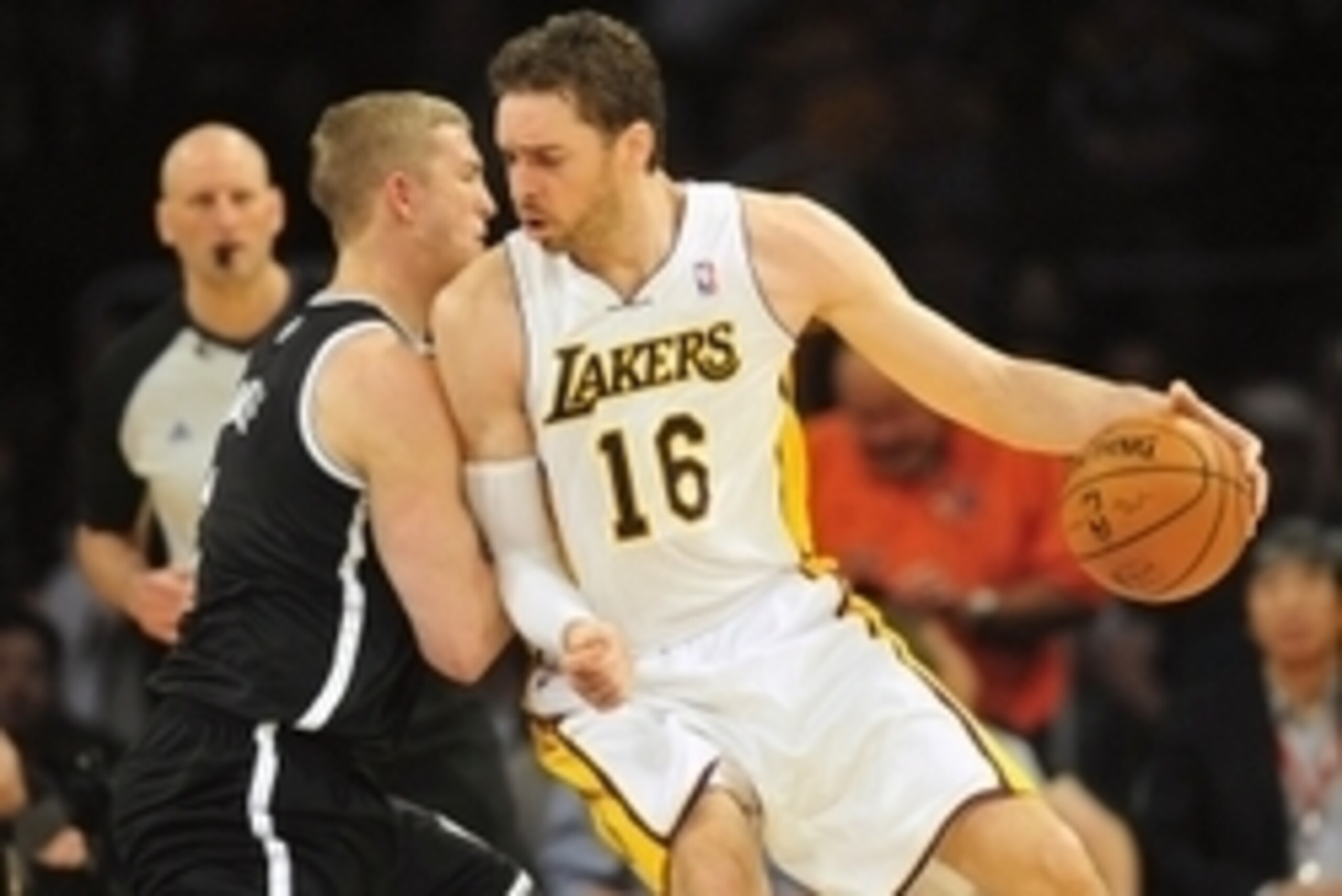 February 23, 2014; Los Angeles, CA, USA; Los Angeles Lakers center Pau Gasol (16) moves the ball against Brooklyn Nets power forward Mason Plumlee (1) during the first half at Staples Center. Mandatory Credit: Gary A. Vasquez-USA TODAY Sports
