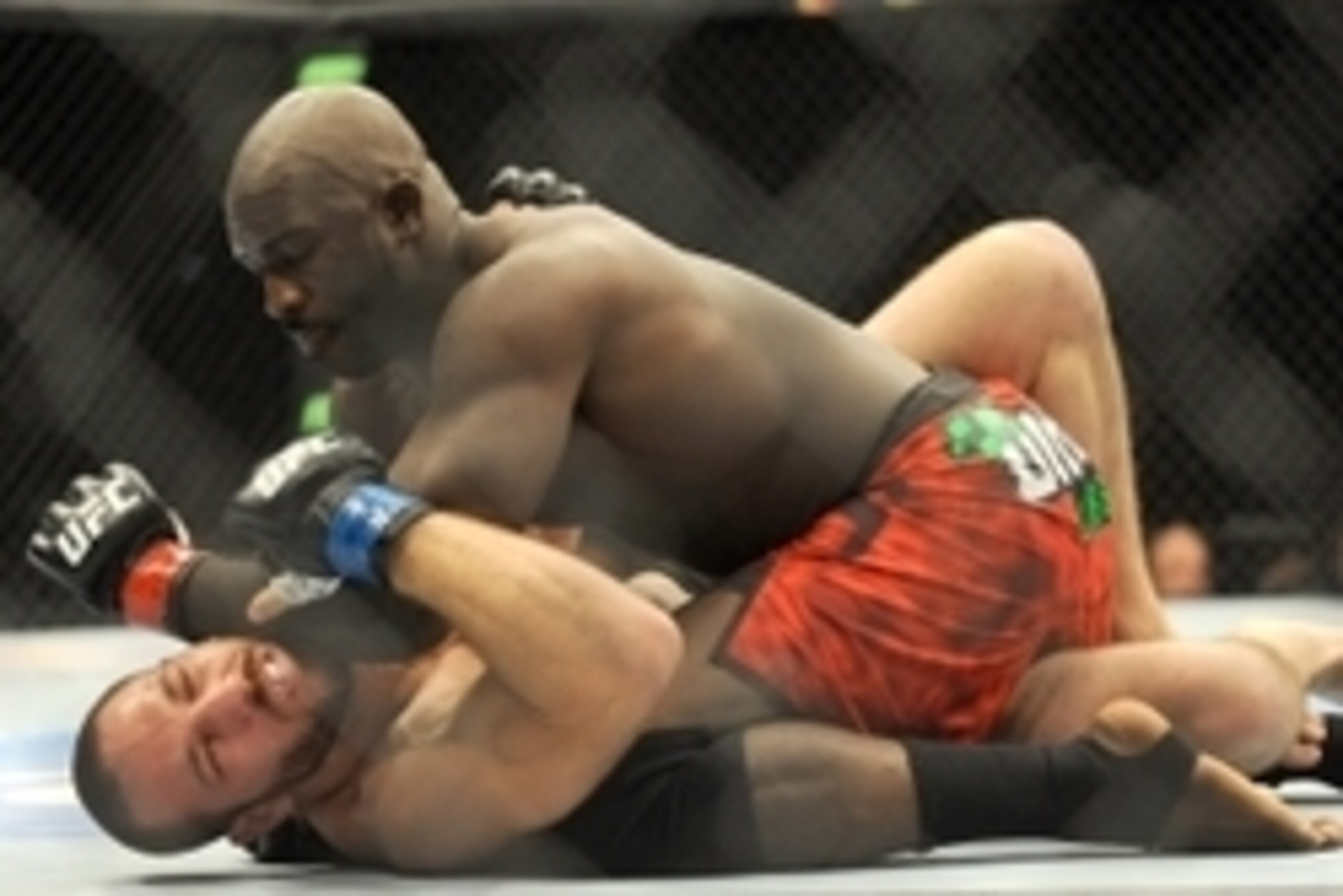 Jul 5, 2014; Las Vegas, NV, USA; Kevin Casey (red gloves) strikes Bubba Bush (blue gloves) during the first round of their middleweight fight at Mandalay Bay Events Center. Mandatory Credit: Stephen R. Sylvanie-USA TODAY Sports