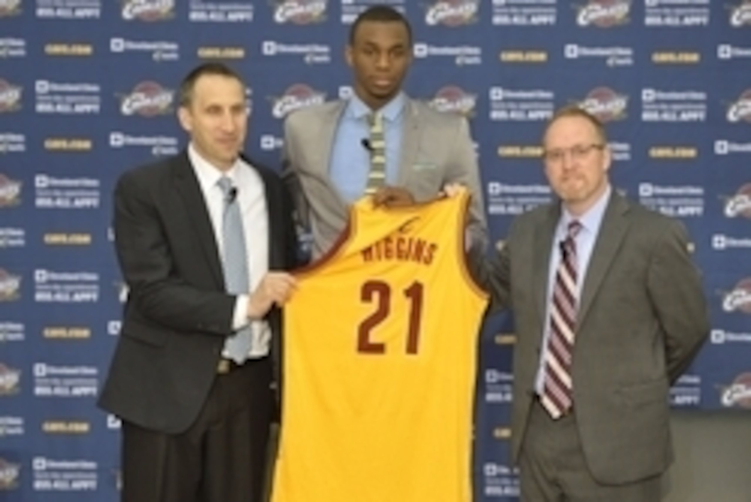 Jun 27, 2014; Independence, OH, USA; Cleveland Cavaliers first round pick Andrew Wiggins (21) is introduced by head coach David Blatt (left) and general manager David Griffin at Cleveland Clinic Courts.  Mandatory Credit: David Richard-USA TODAY Sports