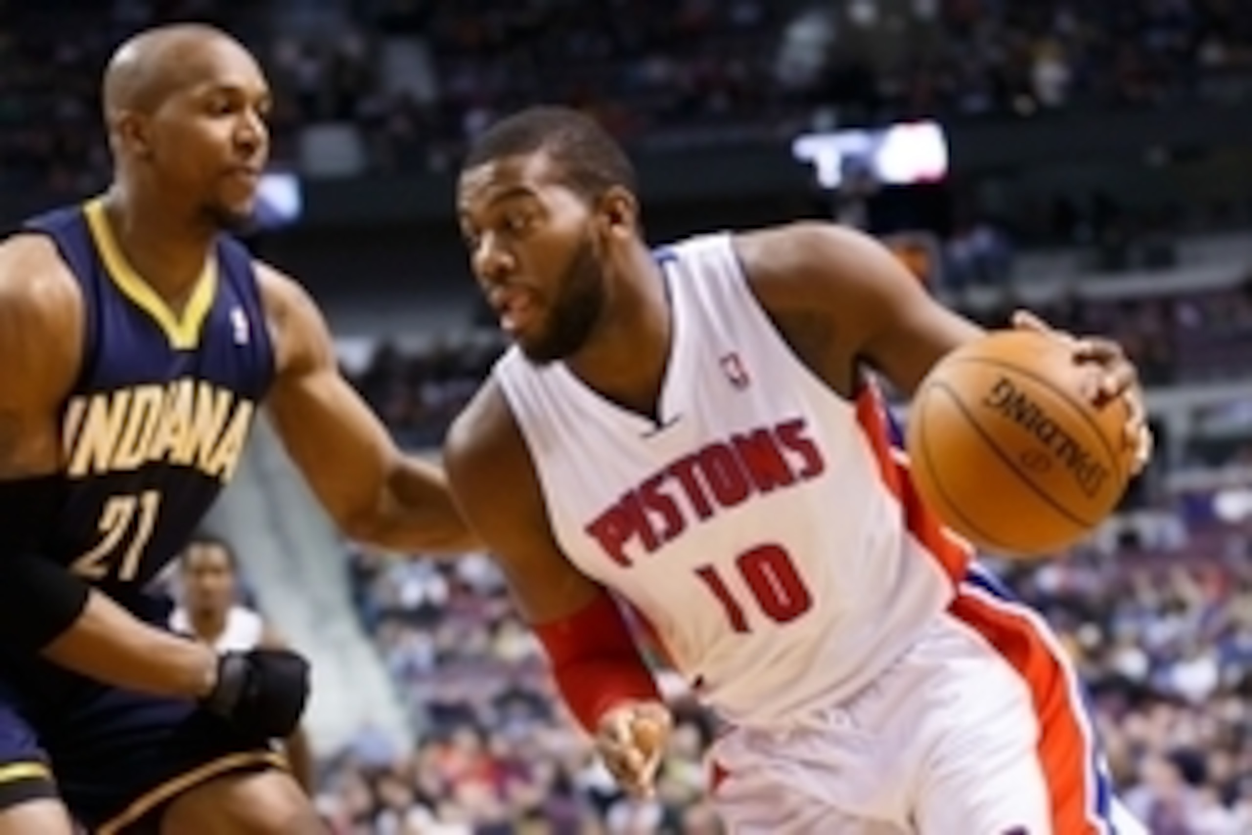 Mar 15, 2014; Auburn Hills, MI, USA; Detroit Pistons forward Greg Monroe (10) dribbles around Indiana Pacers format David West (21) at The Palace of Auburn Hills. Mandatory Credit: Rick Osentoski-USA TODAY Sports