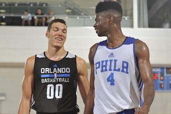 ORLANDO, FL - JULY 5: Aaron Gordon #00 of the Orlando Magic speaks with Nerlens Noel #4 of the Philadelphia 76ers during a game on July 5, 2014 at Amway Center in Orlando, Florida. NOTE TO USER: User expressly acknowledges and agrees that, by downloading 