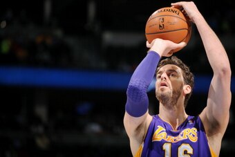 DENVER, CO - March 7: Pau Gasol #16 of the Los Angeles Lakers attempts a free throw against the Denver Nuggets on March 7, 2014 at the Pepsi Center in Denver, Colorado. NOTE TO USER: User expressly acknowledges and agrees that, by downloading and/or using