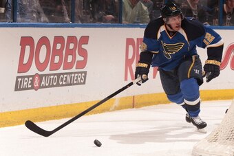 ST. LOUIS, MO - APRIL 08: Derek Roy #12 of the St. Louis Blues handles the puck against the Washington Capitals during an NHL game on April 8, 2014 at Scottrade Center in St. Louis, Missouri. (Photo by Mark Buckner/NHLI via Getty Images)