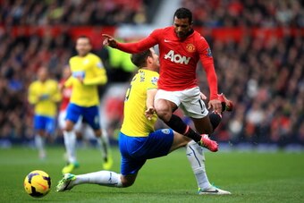 MANCHESTER, ENGLAND - DECEMBER 07:  Nani of Manchester United goes past the tackle from Michael Williamson of Newcastle during the Barclays Premier League match between Manchester United and Newcastle United at Old Trafford on December 7, 2013 in Manchest