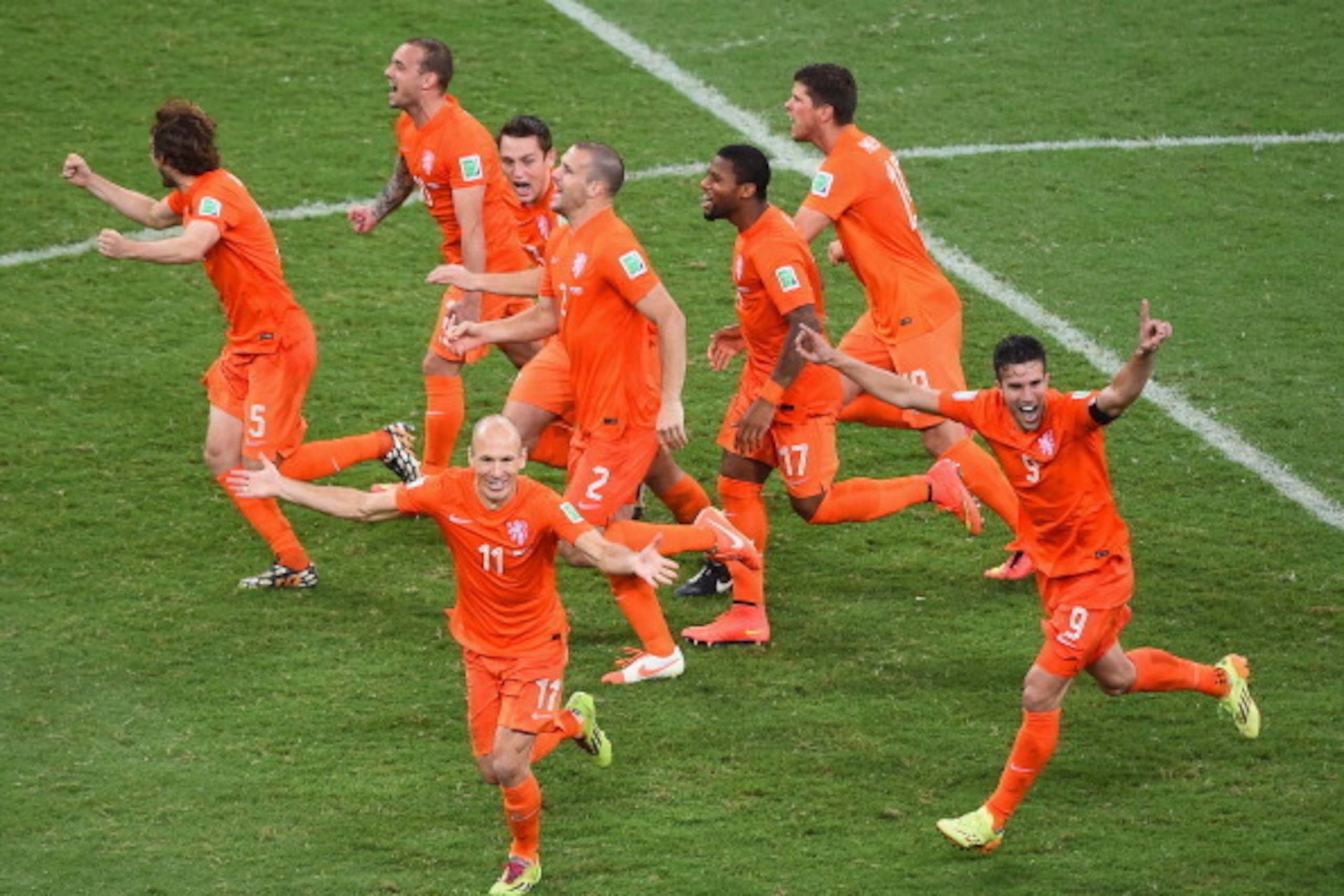 SALVADOR, BRAZIL - JULY 05:  Daley Blind, Wesley Sneijder, Stefan de Vrij, Arjen Robben, Ron Vlaar, Jeremain Lens, Klaas-Jan Huntelaar and Robin van Persie of the Netherlands celebrate after defeating Costa Rica in a penalty shootout during the 2014 FIFA 