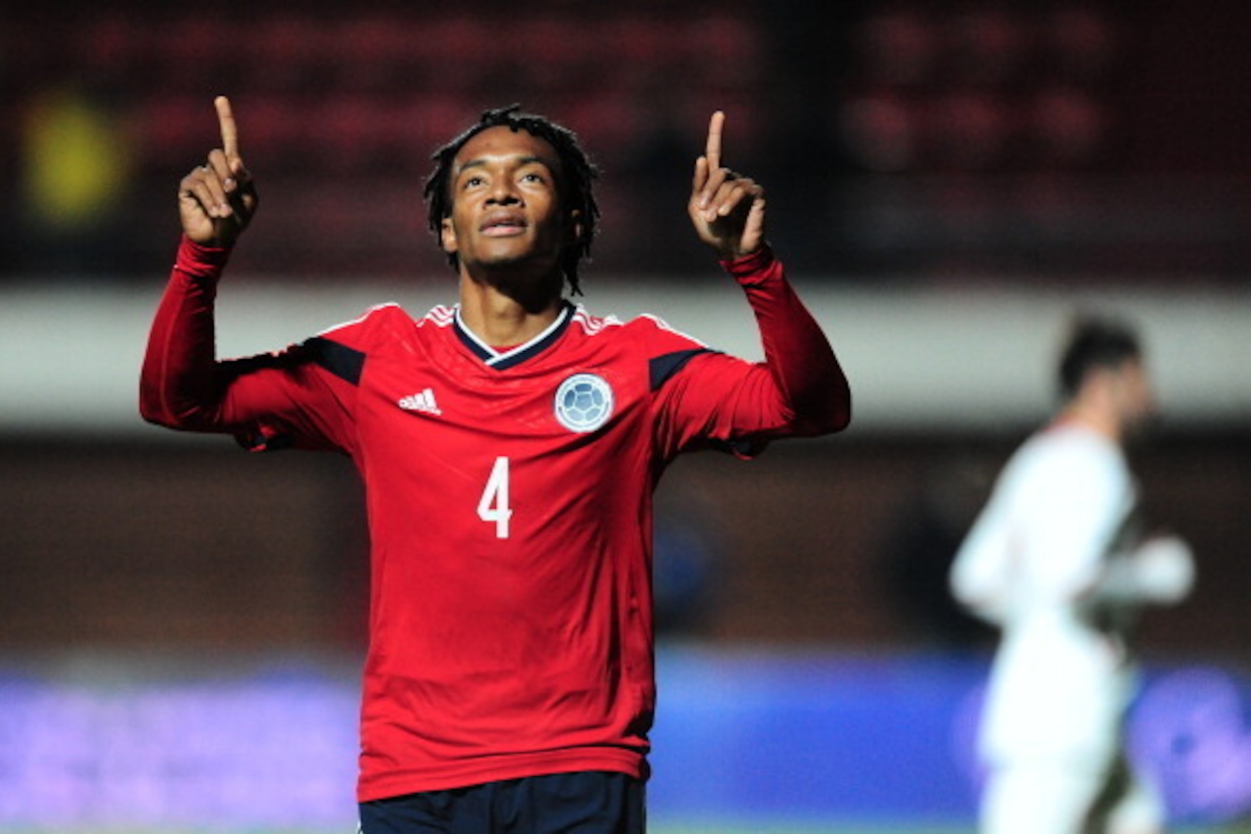 BUENOS AIRES, ARGENTINA - JUNE 06: Juan Cuadrado of Colombia celebrates after shooting a penalty kick to score the second goal during the International Friendly Match between Colombia and Jordan at Pedro Bidegain Stadium on June 06, 2014 in Buenos Aires, 