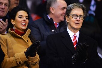 LIVERPOOL, ENGLAND - JANUARY 18:  Liverpool co-owner John Henry looks on with wife Linda Pizzuti prior to the Barclays Premier League match between Liverpool and Aston Villa at Anfield on January 18, 2014 in Liverpool, England.  (Photo by Michael Regan/Ge