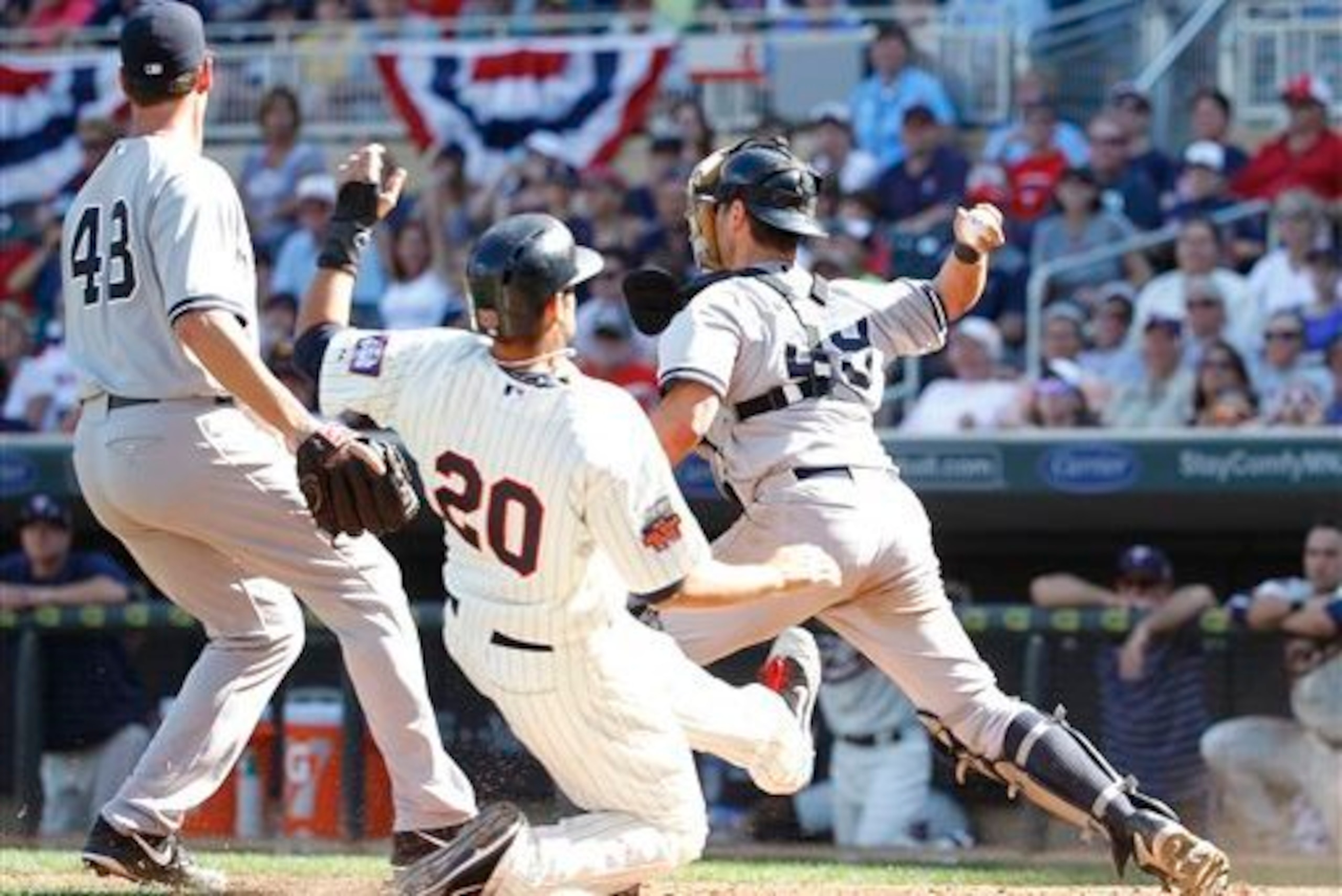 Francisco Cervelli's (right) throwing error caused Minnesota's walk-off victory on Saturday, July 5.