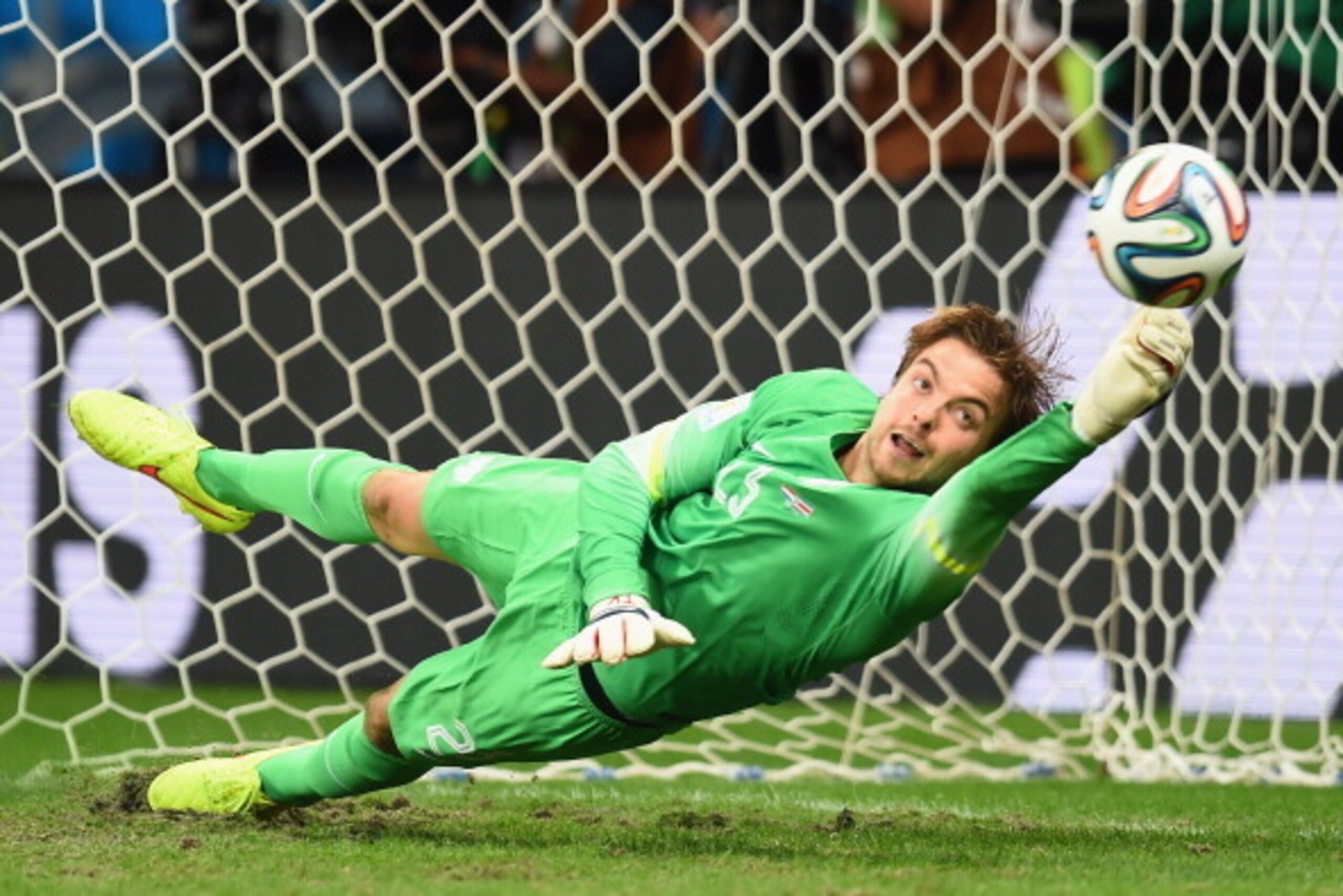 SALVADOR, BRAZIL - JULY 05: Tim Krul of the Netherlands saves a penalty kick by Michael Umana of Costa Rica (not pictured) to win in a shootout during the 2014 FIFA World Cup Brazil Quarter Final match between the Netherlands and Costa Rica at Arena Fonte