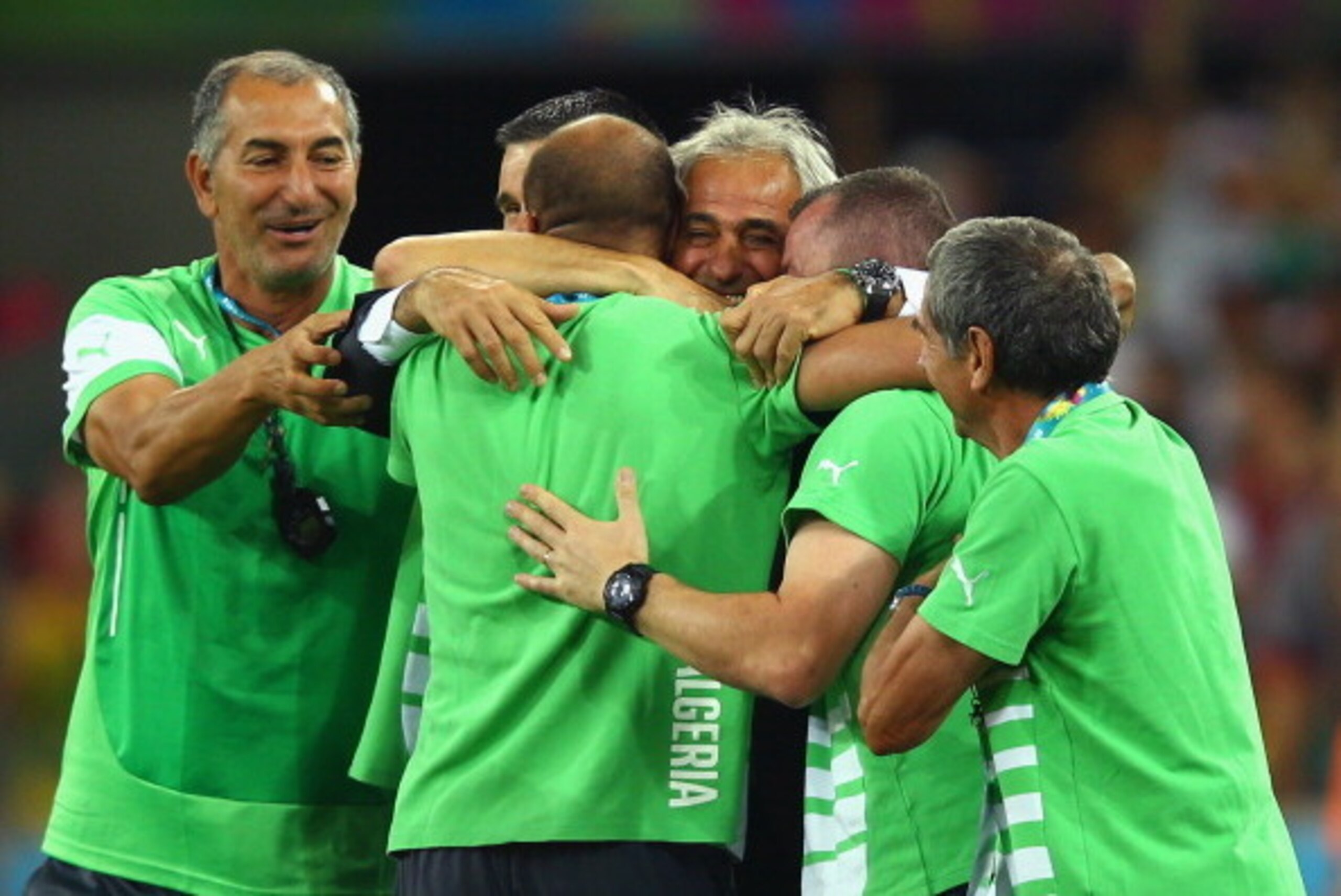 CURITIBA, BRAZIL - JUNE 26: Head coach Vahid Halilhodzic of Algeria (C) hugs his staff after a 1-1 draw during the 2014 FIFA World Cup Brazil Group H match between Algeria and Russia at Arena da Baixada on June 26, 2014 in Curitiba, Brazil.  (Photo by Cli