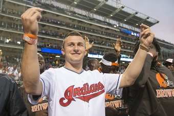 CLEVELAND, OH - JUNE 4:  Rookie draft pick Johnny Manziel of the NFL Cleveland Browns acknowledges the crowd prior to the game between the Cleveland Indians and the Boston Red Sox along with other Brows rookies at Progressive Field on June 4, 2014 in Clev