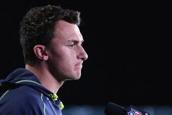 INDIANAPOLIS, IN - FEBRUARY 21: Former Texas A&M quarterback Johnny Manziel speaks to the media during the 2014 NFL Combine at Lucas Oil Stadium on February 21, 2014 in Indianapolis, Indiana. (Photo by Joe Robbins/Getty Images)