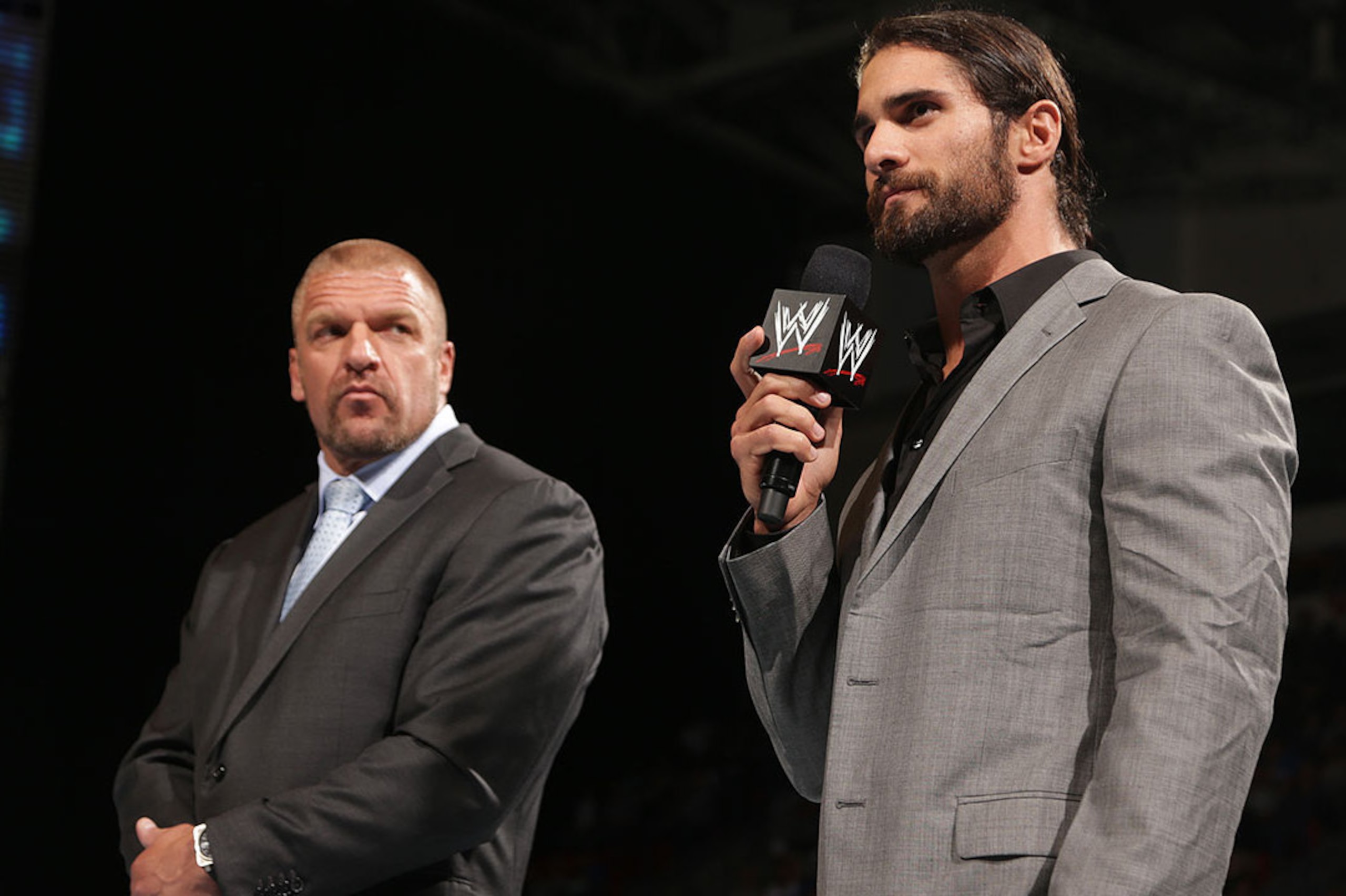 Triple H stands with his new ally Seth Rollins.