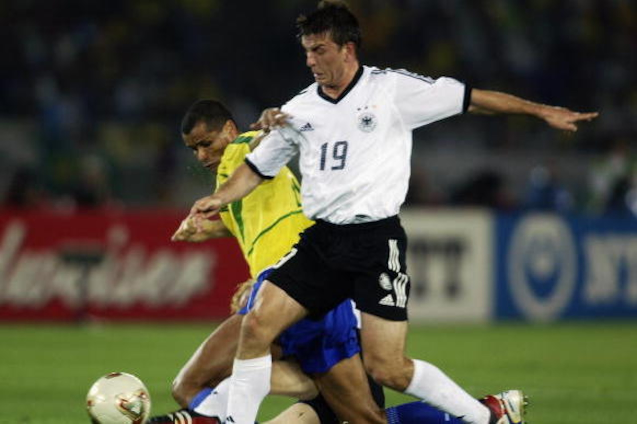 YOKOHAMA - JUNE 30:  Rivaldo of Brazil is challenged by Bernd Schneider and Carsten Ramelow of Germany during the Germany v Brazil, World Cup Final match played at the International Stadium Yokohama in Yokohama, Japan on June 30, 2002. Brazil won 2-0. (Ph