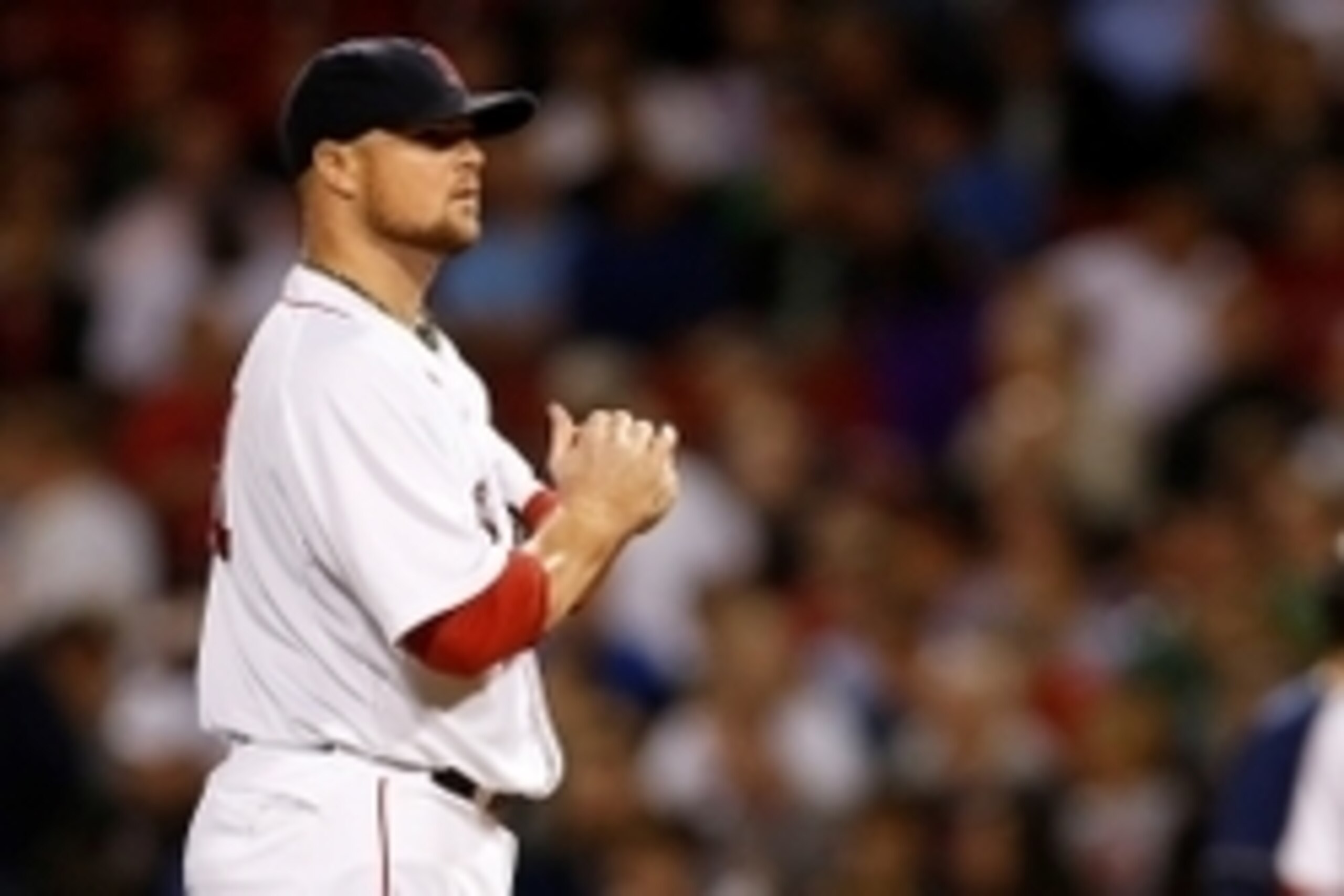 Jun 12, 2014; Boston, MA, USA;  Boston Red Sox pitcher Jon Lester (31) holds the ball during the eighth inning against the Cleveland Indians at Fenway Park. Mandatory Credit: Greg M. Cooper-USA TODAY Sports