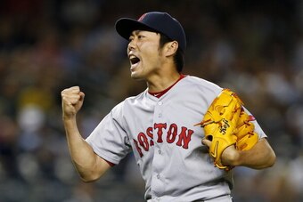 NEW YORK, NY - JUNE 28: Koji Uehara #19 of the Boston Red Sox reacts after striking out Brian McCann #34 of the New York Yankees in the ninth inning to end the game at Yankee Stadium on June 28, 2014 in the Bronx borough of New York City. The Red Sox defe