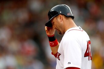 BOSTON, MA - JULY 1: A.J. Pierzynski #40 of the Boston Red Sox leaves the field after being tagged out at second attempting to stretch a single into a double in the second  inning against the Chicago Cubs at Fenway Park on July 1, 2014 in Boston, Massachu