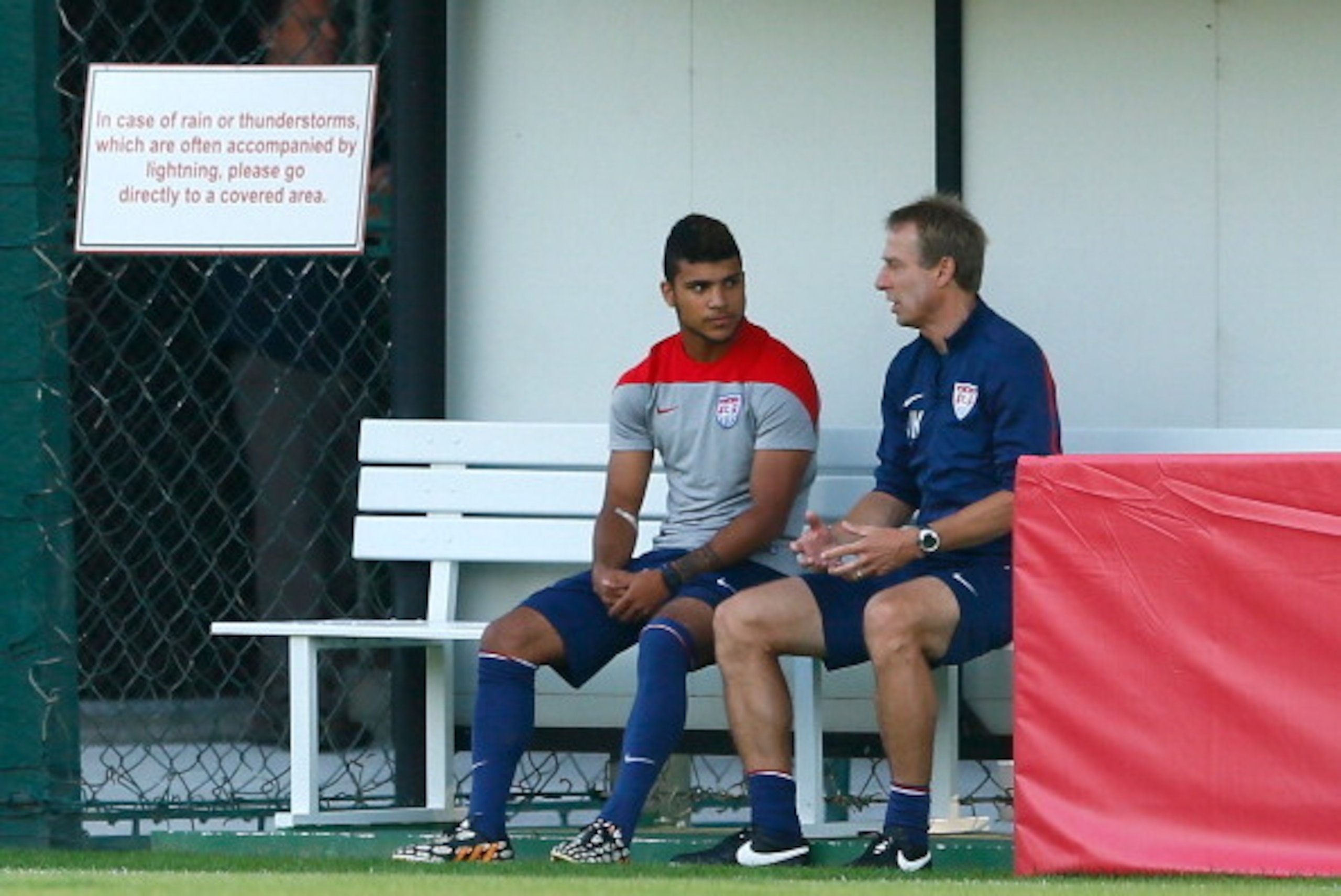 SAO PAULO, BRAZIL - JUNE 23:  Head coach Jurgen Klinsmann of the the United States speaks with DeAndre Yedlin prior to training at Sao Paulo FC on June 23, 2014 in Sao Paulo, Brazil.  (Photo by Kevin C. Cox/Getty Images)