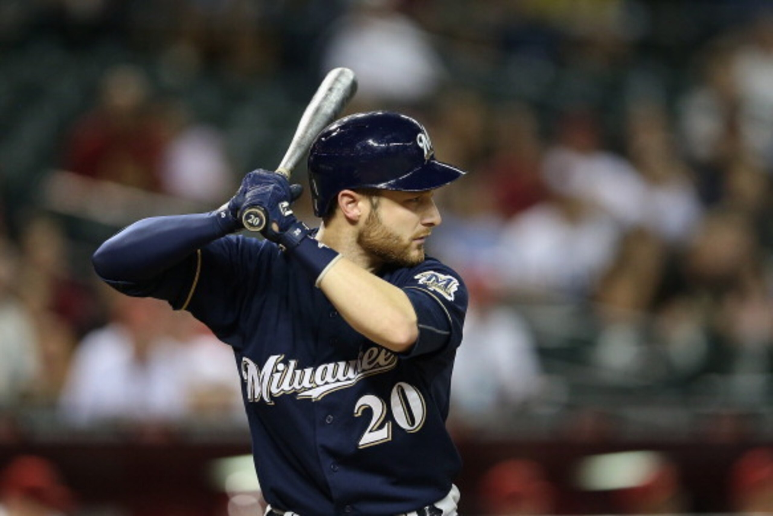 PHOENIX, AZ - JUNE 17:  Jonathan Lucroy #20 of the Milwaukee Brewers bats against the Arizona Diamondbacks during the MLB game at Chase Field on June 17, 2014 in Phoenix, Arizona.  The Brewers defeated the Diamondbacks 7-5.  (Photo by Christian Petersen/G