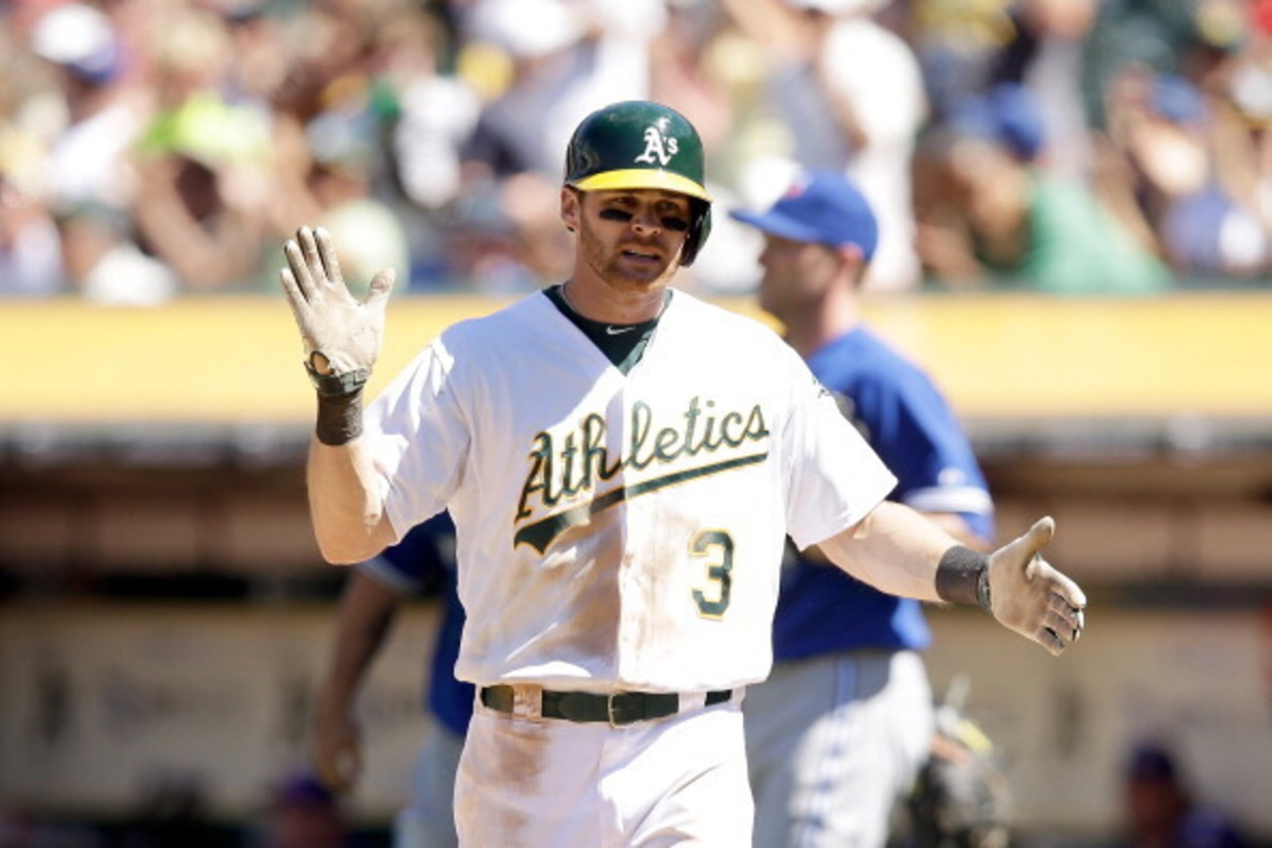 OAKLAND, CA - JULY 06:  Craig Gentry #3 of the Oakland Athletics reacts after scoring on a double by Derek Norris #36 in the eighth inning of their game against the Toronto Blue Jays at O.co Coliseum on July 6, 2014 in Oakland, California.  (Photo by Ezra