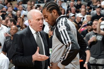 SAN ANTONIO, TX - JUNE 15: Gregg Popovich and Kawhi Leonard #2 of the San Antonio Spurs converse before Game Five of the 2014 NBA Finals between the Miami Heat and San Antonio Spurs at AT&T Center on June 15, 2014 in San Antonio, Texas. NOTE TO USER: User