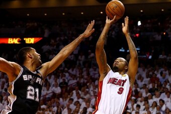 MIAMI, FL - JUNE 12:  Rashard Lewis #9 of the Miami Heat takes a shot over Tim Duncan #21 of the San Antonio Spurs during Game Four of the 2014 NBA Finals at American Airlines Arena on June 12, 2014 in Miami, Florida. NOTE TO USER: User expressly acknowle