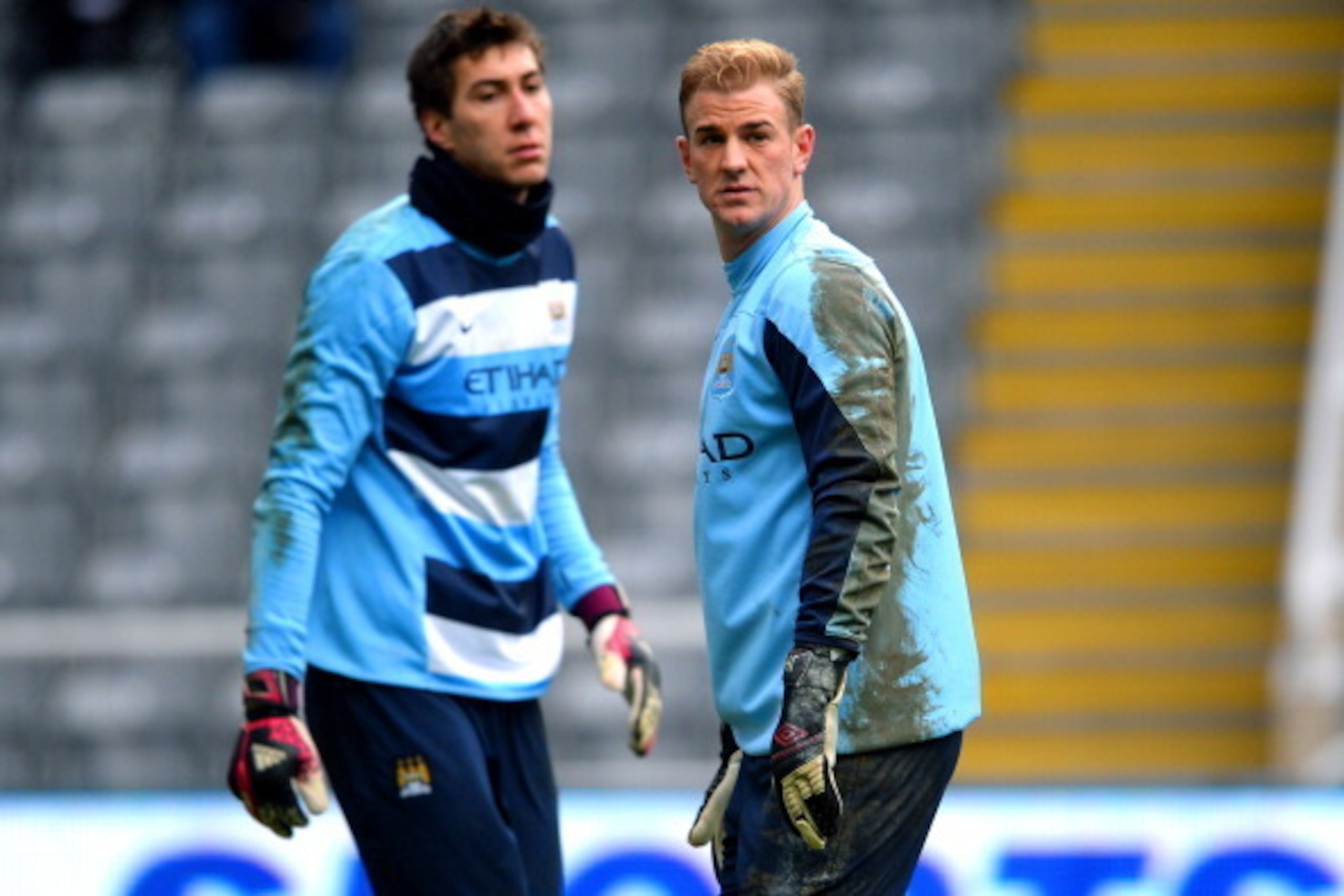 NEWCASTLE UPON TYNE, ENGLAND - JANUARY 12:  (L-R) Manchester City goalkeepers Costel Pantilimon and Joe Hart warm up prior to kickoff during the Barclays Premier League match between Newcastle United and Manchester City at St James' Park on January 12, 20