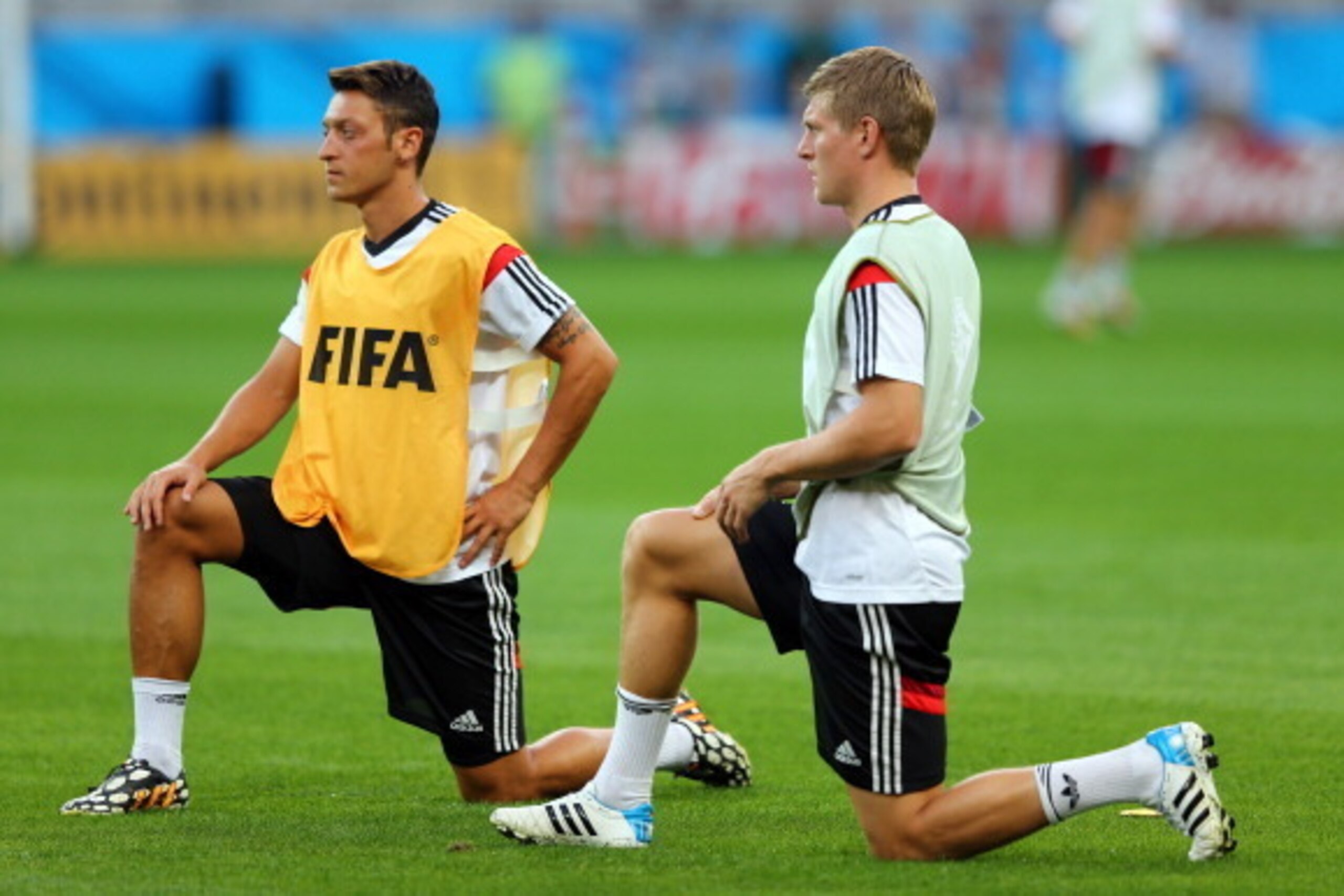 BELO HORIZONTE, BRAZIL - JULY 07: Toni Kroos (R) of Germany stretches during the German national team training at Estadio Mineirao on July 7, 2014 in Belo Horizonte, Brazil. (Photo by Martin Rose/Getty Images) BELO HORIZONTE, BRAZIL - JULY 07: Toni Kroos (R) of Germany stretches during the German national team training at Estadio Mineirao on July 7, 2014 in Belo Horizonte, Brazil. (Photo by Martin Rose/Getty Images)