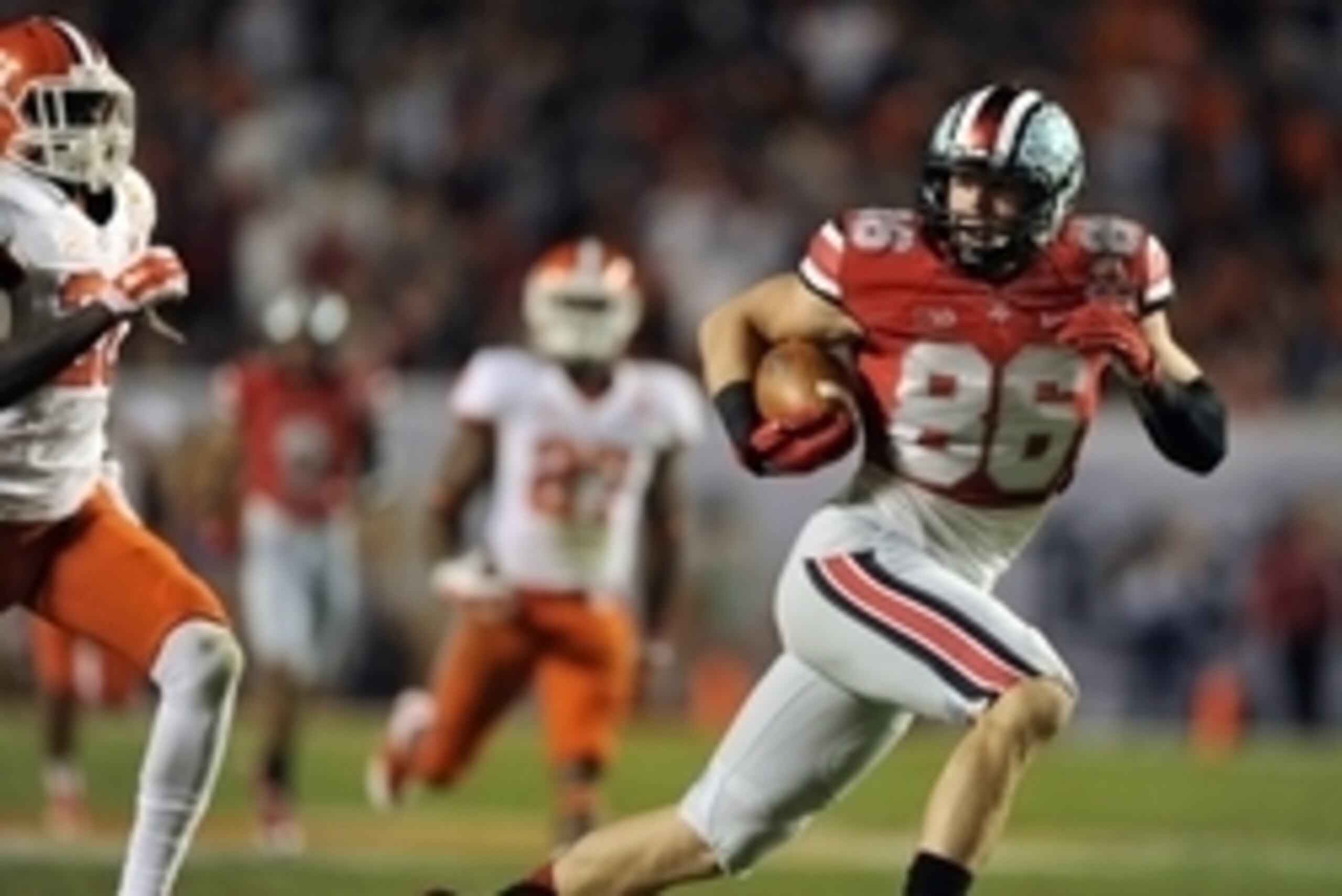 Jan 3, 2014; Miami Gardens, FL, USA; Ohio State Buckeyes tight end Jeff Heuerman (86) scores a touchdown as Clemson Tigers defensive back Bashaud Breeland (17) and safety Jayron Kearse (20) defend in the first half  of the 2014 Orange Bowl college footbal