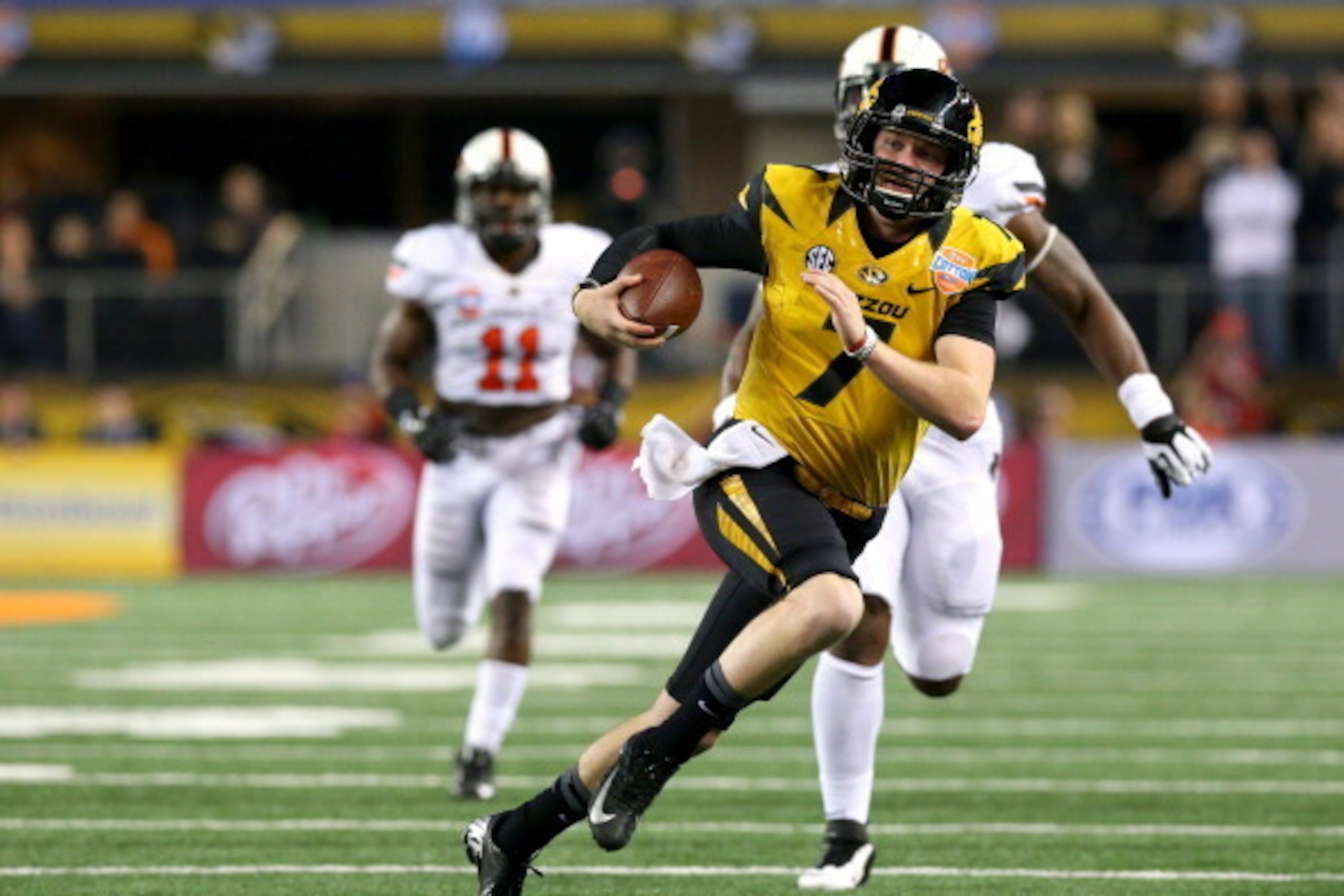 ARLINGTON, TX - JANUARY 03:  Quarterback Maty Mauk #7 of the Missouri Tigers runs the ball against the Oklahoma State Cowboys in the second quarter during the AT&T Cotton Bowl on January 3, 2014 in Arlington, Texas.  (Photo by Ronald Martinez/Getty Images
