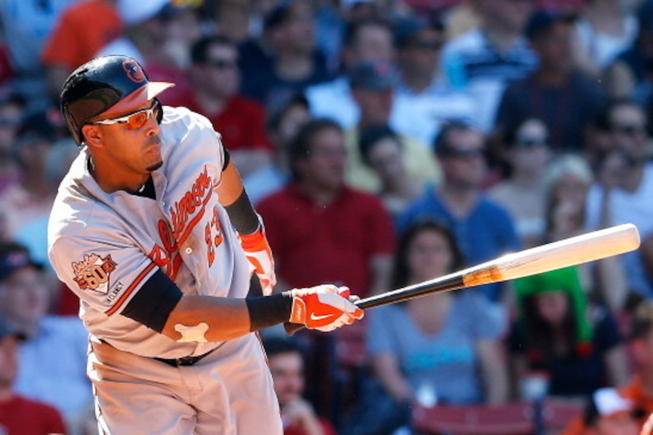 BOSTON, MA - JULY 6:  Nelson Cruz #23 of the Baltimore Orioles singles in a run against the Boston Red Sox in the seventh inning at Fenway Park on July 6, 2014 in Boston, Massachusetts.  (Photo by Jim Rogash/Getty Images)