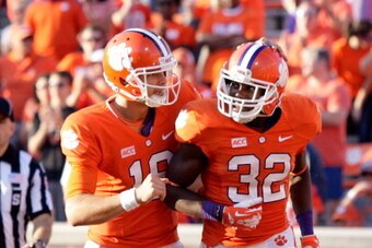 CLEMSON, SC - SEPTEMBER 28: Cole Stoudt #18 and C.J. Davidson #32 of the Clemson Tigers celebrate after scoring a touchdown during the game against the Wake Forest Demon Deacons at Memorial Stadium on September 28, 2013 in Clemson, South Carolina. (Photo 