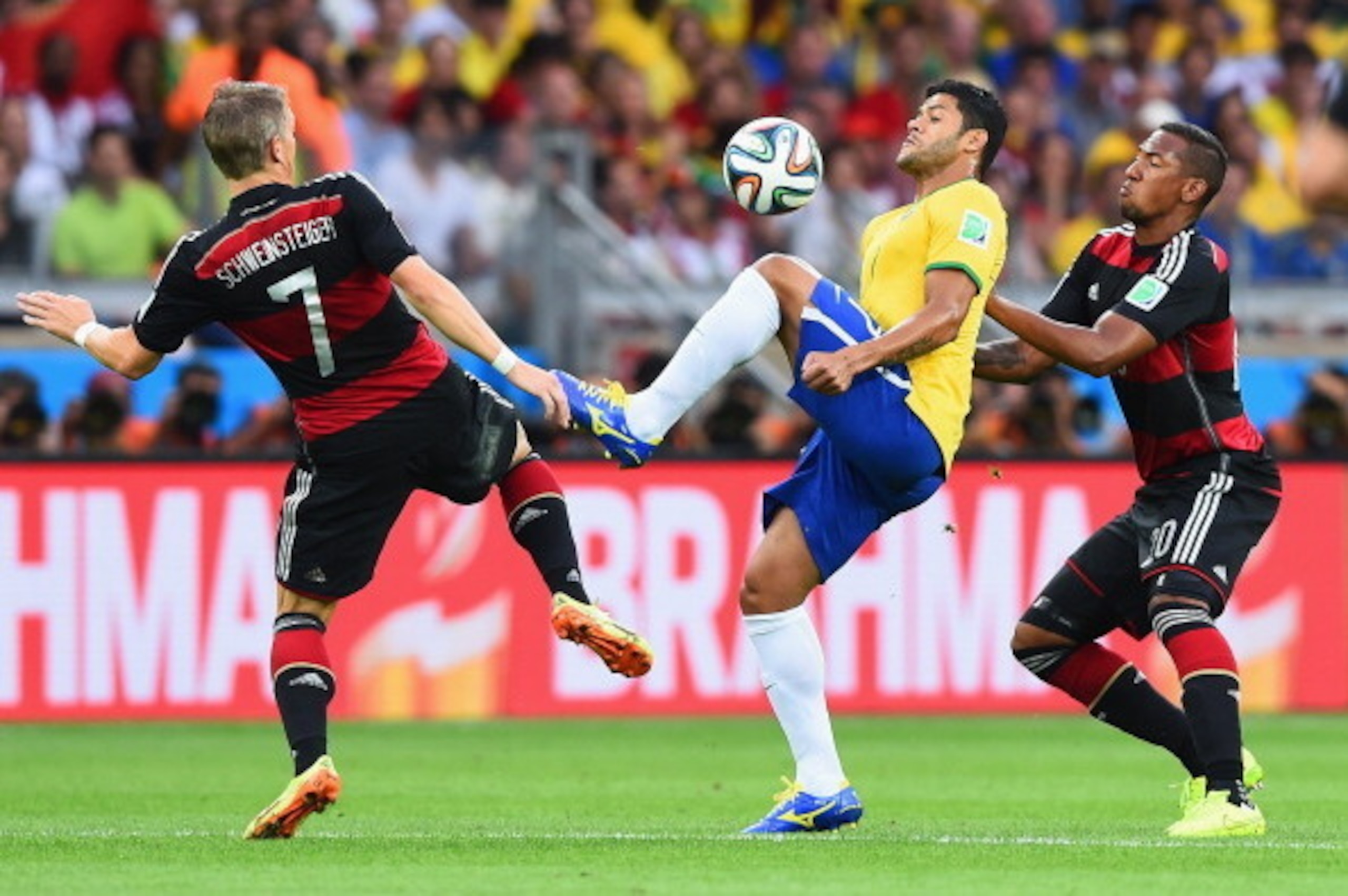 BELO HORIZONTE, BRAZIL - JULY 08:  Hulk of Brazil controls the ball against Bastian Schweinsteiger (L) and Jerome Boateng of Germany during the 2014 FIFA World Cup Brazil Semi Final match between Brazil and Germany at Estadio Mineirao on July 8, 2014 in B