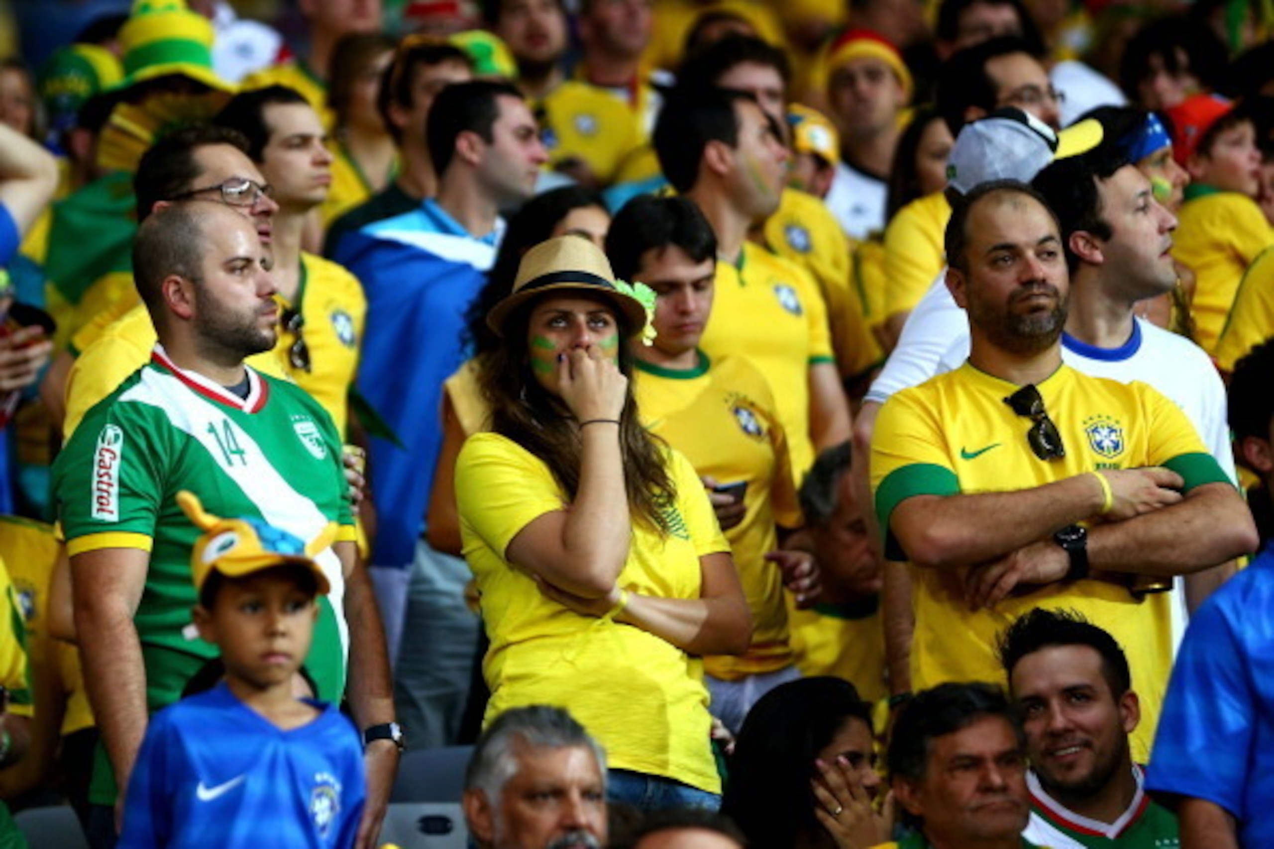 BELO HORIZONTE, BRAZIL - JULY 08:  Brazil fans look dejected during the 2014 FIFA World Cup Brazil Semi Final match between Brazil and Germany at Estadio Mineirao on July 8, 2014 in Belo Horizonte, Brazil.  (Photo by Michael Steele/Getty Images)