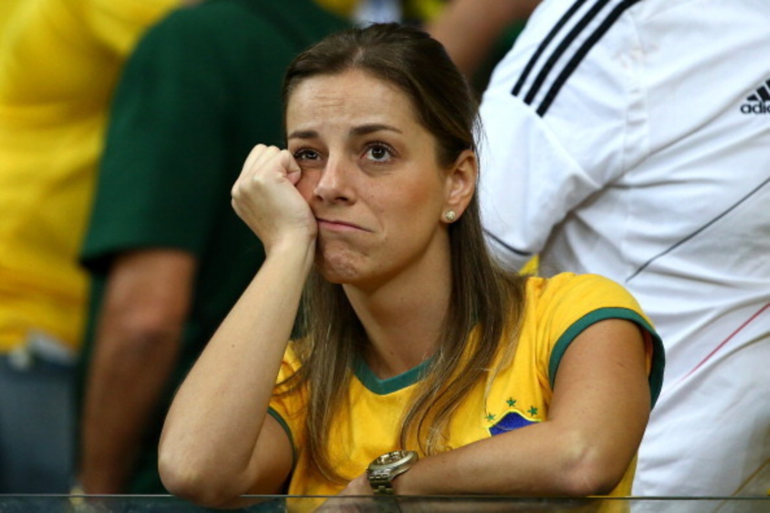 BELO HORIZONTE, BRAZIL - JULY 08:  A dejected Brazil fan looks on during the 2014 FIFA World Cup Brazil Semi Final match between Brazil and Germany at Estadio Mineirao on July 8, 2014 in Belo Horizonte, Brazil.  (Photo by Robert Cianflone/Getty Images)