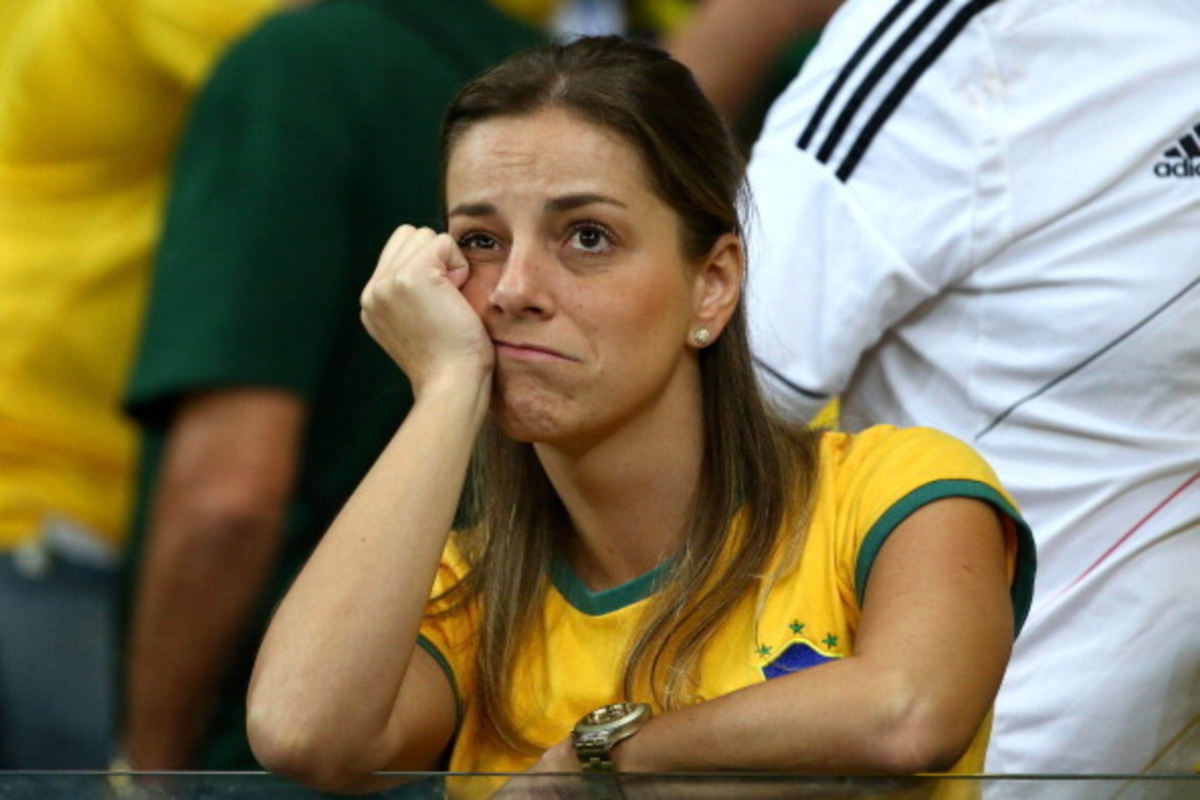 BELO HORIZONTE, BRAZIL - JULY 08:  A dejected Brazil fan looks on during the 2014 FIFA World Cup Brazil Semi Final match between Brazil and Germany at Estadio Mineirao on July 8, 2014 in Belo Horizonte, Brazil.  (Photo by Robert Cianflone/Getty Images)