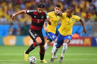 BELO HORIZONTE, BRAZIL - JULY 08:  Sami Khedira of Germany controls the ball as Oscar (center) and Fernandinho of Brazil give chase during the 2014 FIFA World Cup Brazil Semi Final match between Brazil and Germany at Estadio Mineirao on July 8, 2014 in Be