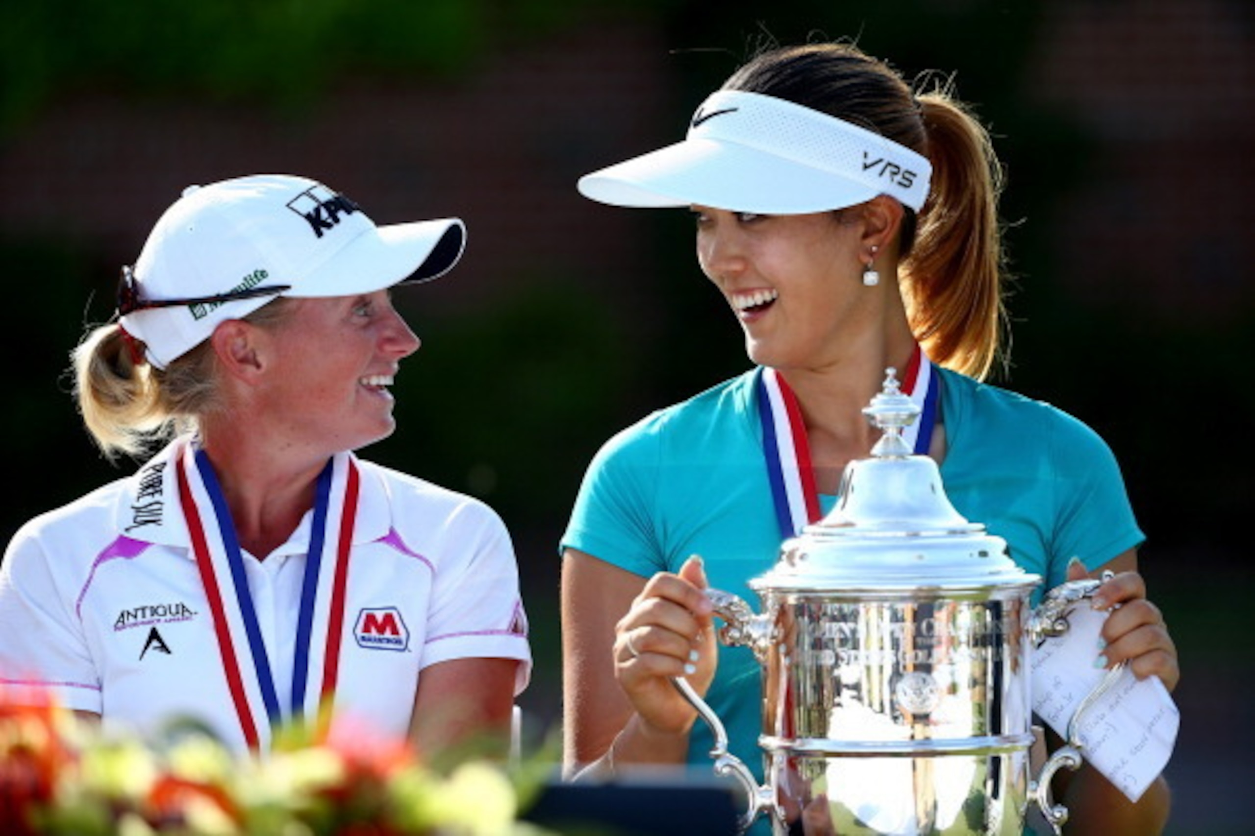PINEHURST, NC - JUNE 22:  (L-R) Stacy Lewis of the United States talks to Michelle Wie of the United States after Wie won the 69th U.S. Women's Open at Pinehurst Resort & Country Club, Course No. 2 on June 22, 2014 in Pinehurst, North Carolina.  (Photo by