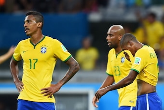 BELO HORIZONTE, BRAZIL - JULY 08:  (L-R) Luiz Gustavo, Maicon and Fernandinho of Brazil look dejected after allowing a goal during the 2014 FIFA World Cup Brazil Semi Final match between Brazil and Germany at Estadio Mineirao on July 8, 2014 in Belo Horiz