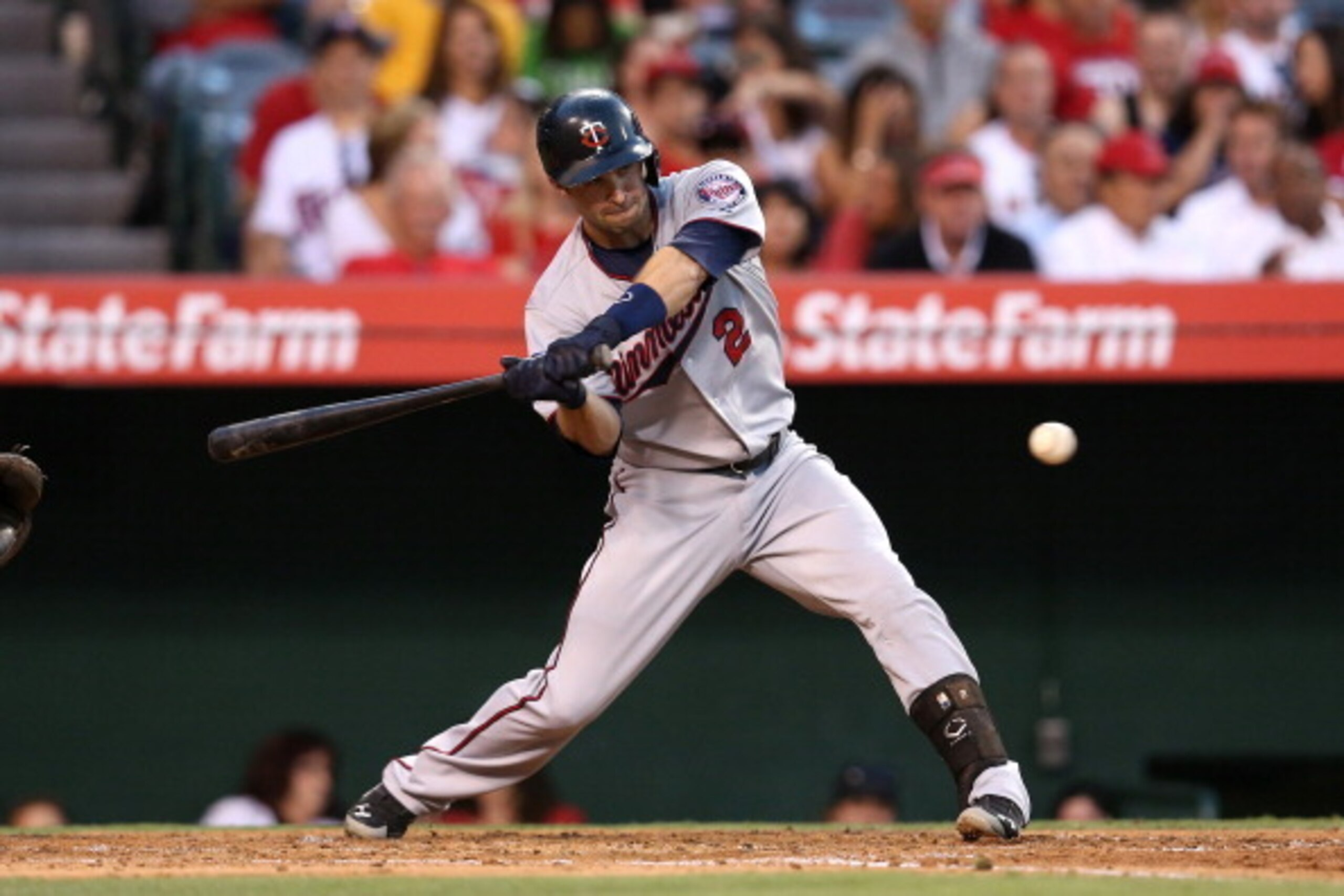 ANAHEIM, CA - JUNE 24:  Brian Dozier #2 of the Minnesota Twins hits an RBI single to tie the score at 5-5 in the second inning against the Los Angeles Angels of Anaheim at Angel Stadium of Anaheim on June 24, 2014 in Anaheim, California.  (Photo by Stephe