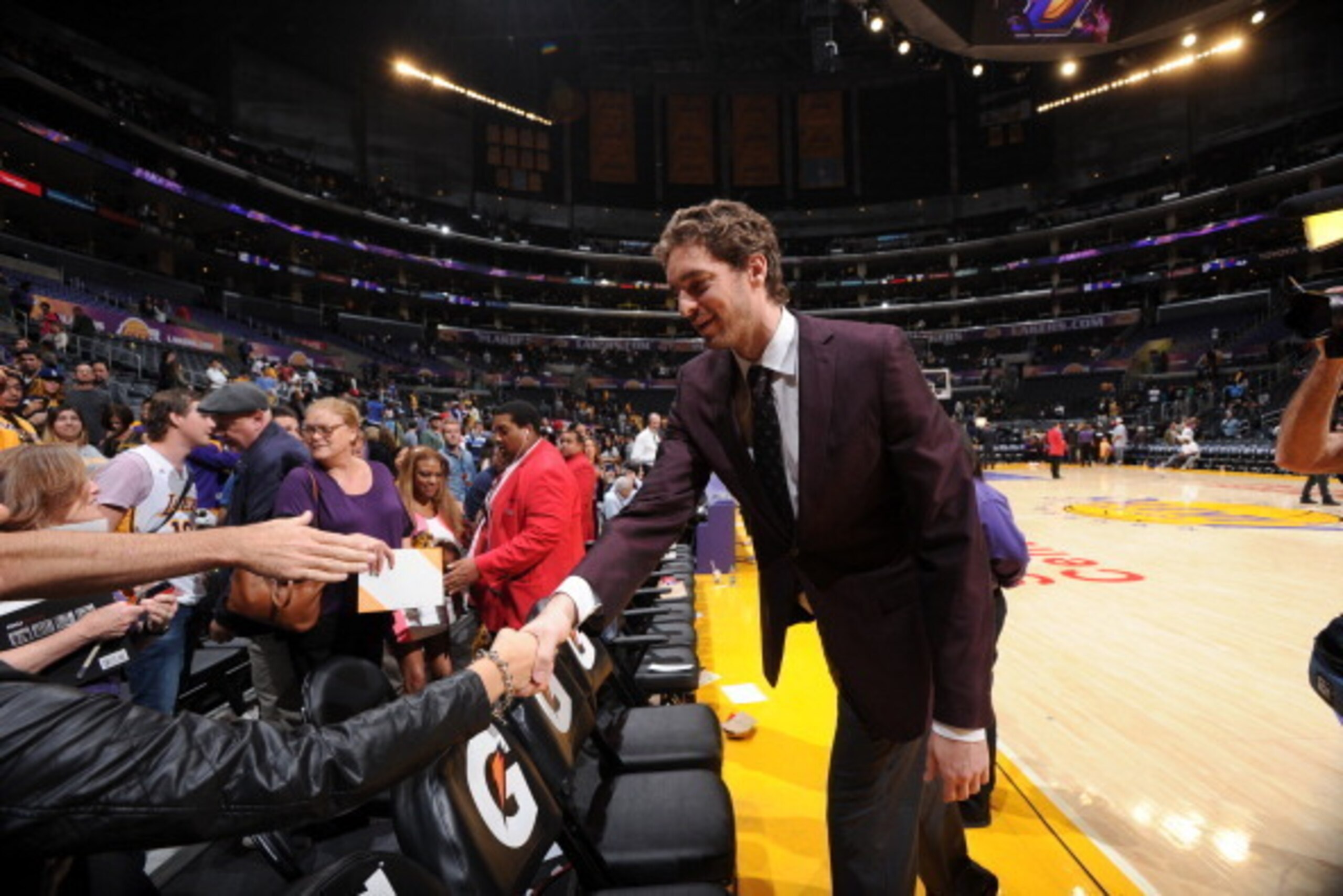 LOS ANGELES, CA - APRIL 13: Pau Gasol #16 of the Los Angeles Lakers greets fans following a game against the Memphis Grizzlies at Staples Center on April 13, 2014 in Los Angeles, California. NOTE TO USER: User expressly acknowledges and agrees that, by do