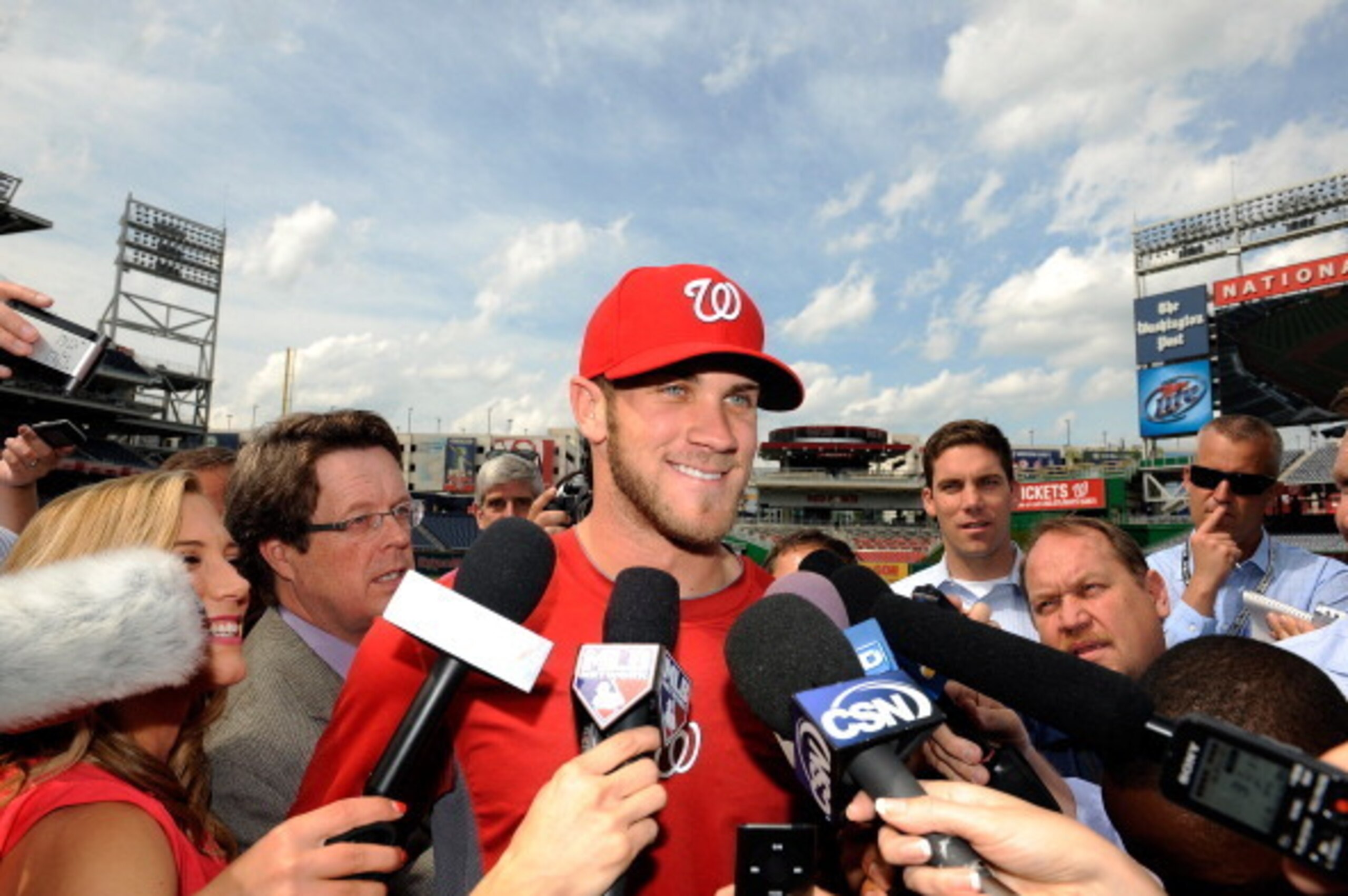 WASHINGTON, DC - MAY 01:  Bryce Harper #34 of the Washington Nationals talks to the media before the game against the Arizona Diamondbacks at Nationals Park on May 1, 2012 in Washington, DC.  (Photo by Greg Fiume/Getty Images)