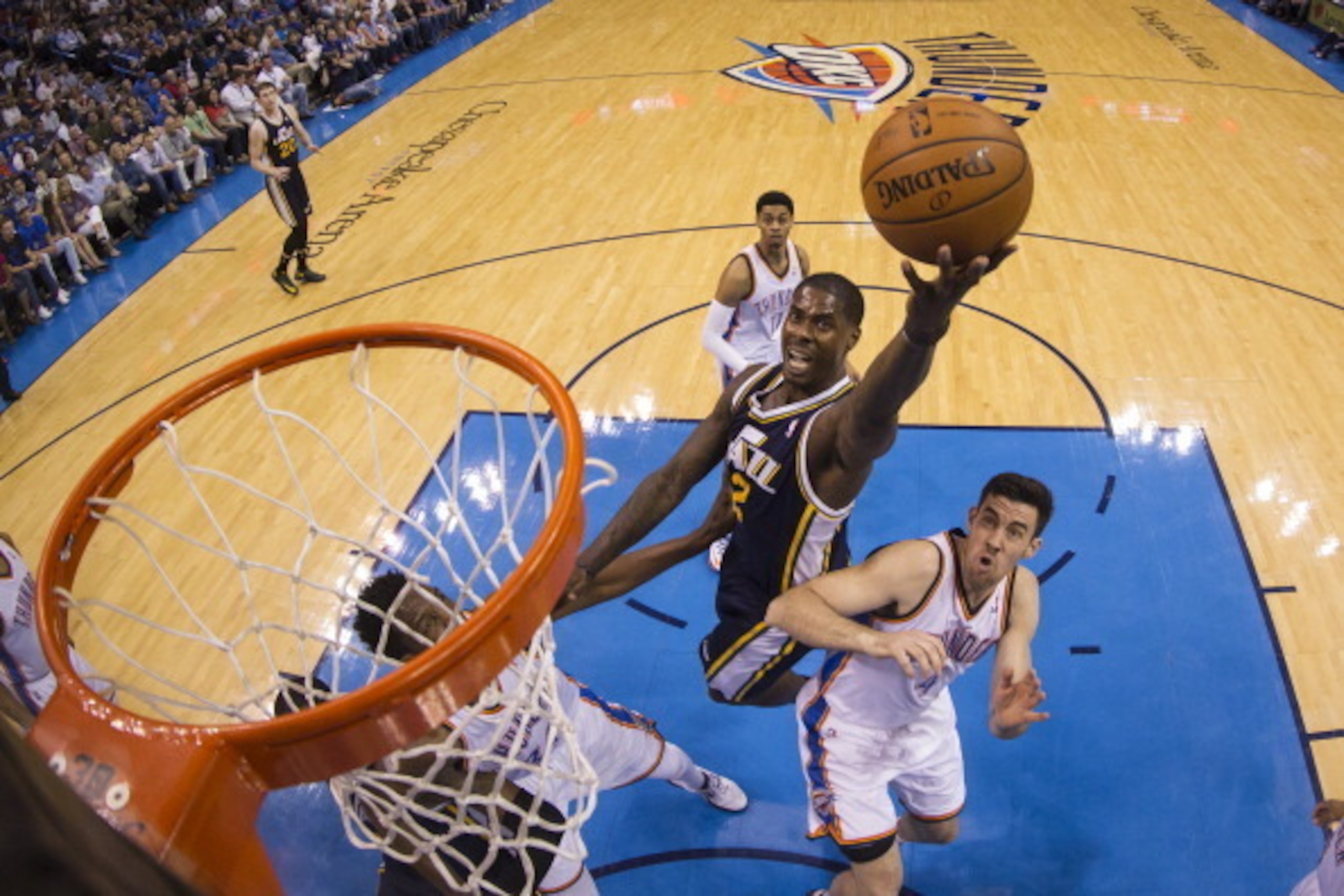 OKLAHOMA CITY, OK - MARCH 30: Marvin Williams #2 of the Utah Jazz drives to the basket against the Oklahoma City Thunder- at the Chesapeake Arena on March 30, 2014 in Oklahoma City, Oklahoma. NOTE TO USER:  User expressly acknowledges and agrees that, by 